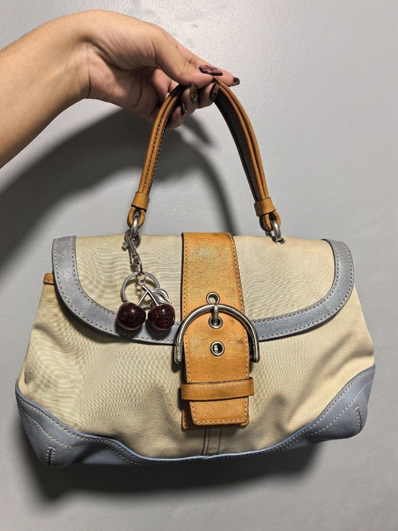 Coach Handbag with Cherry Charm (Category: Luxury Bags & Wallets) located in Manila. Submitted by imjustabag.addict (Listing ID 1421287613, Image 1). Description: Charm not included. Issue: No hangtag Inside zonrox bleached (honestly not a problem for me hehe) Outside stain as per pic (Ang alam ko there's a way to remove that kind of stain like tissue method etc., di ko lang naaasikaso kasi walang time) Minor signs of use. Hard to let go, that's 