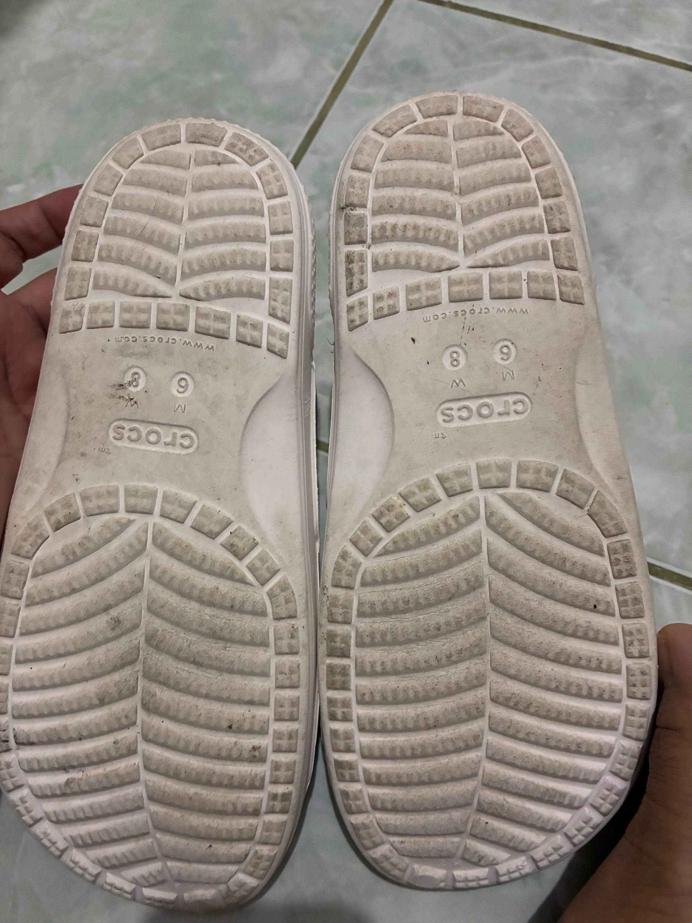 Crocs Women's Sandals Size 8 (Category: Flats & Sandals) located in Legazpi City. Submitted by batutastudio (Listing ID 1421150393, Image 2). Description: - Crocs sandals - Size: W8/M6 - Design: White sandals with rainbow straps - Condition: Some wear on soles - Features: Crocs logo Thank you for viewing this item! 😊 This is a preloved personal piece and will be sold as is. Please refer to the photos for the exact condition, as the item may show