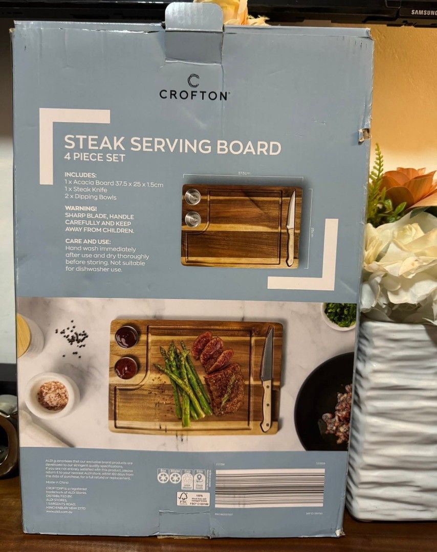 Crofton Steak Serving Board 4 Piece Set (Category: Dinnerware & Cutlery) located in Manila. Submitted by ormelynmal86309 (Listing ID 1421185685, Image 2). Description: - Crofton Steak Serving Board Set - Includes: - Wooden serving board (37.5cm x 25cm x 1.5cm) - Steak knife - Two dipping bowls - Ideal for serving steak and other dishes - Brand new - Comes in original packaging.
