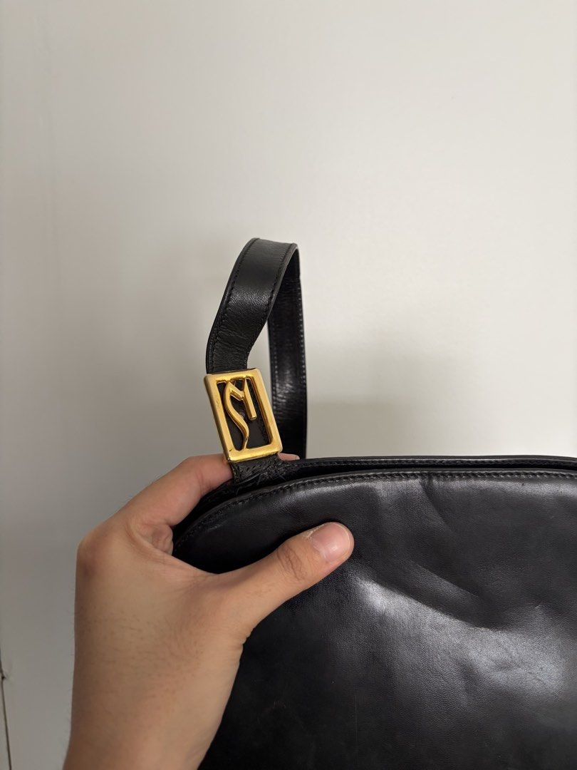 Di Sandro Black Leather Shoulder Bag (Category: Luxury Bags & Wallets) located in Makati City. Submitted by lenyfelix (Listing ID 1421194195, Image 2). Description: - Di Sandro black leather shoulder bag - Genuine leather - Rectangular shape - Long strap - Gold-toned hardware - Interior pocket - Made in Italy.