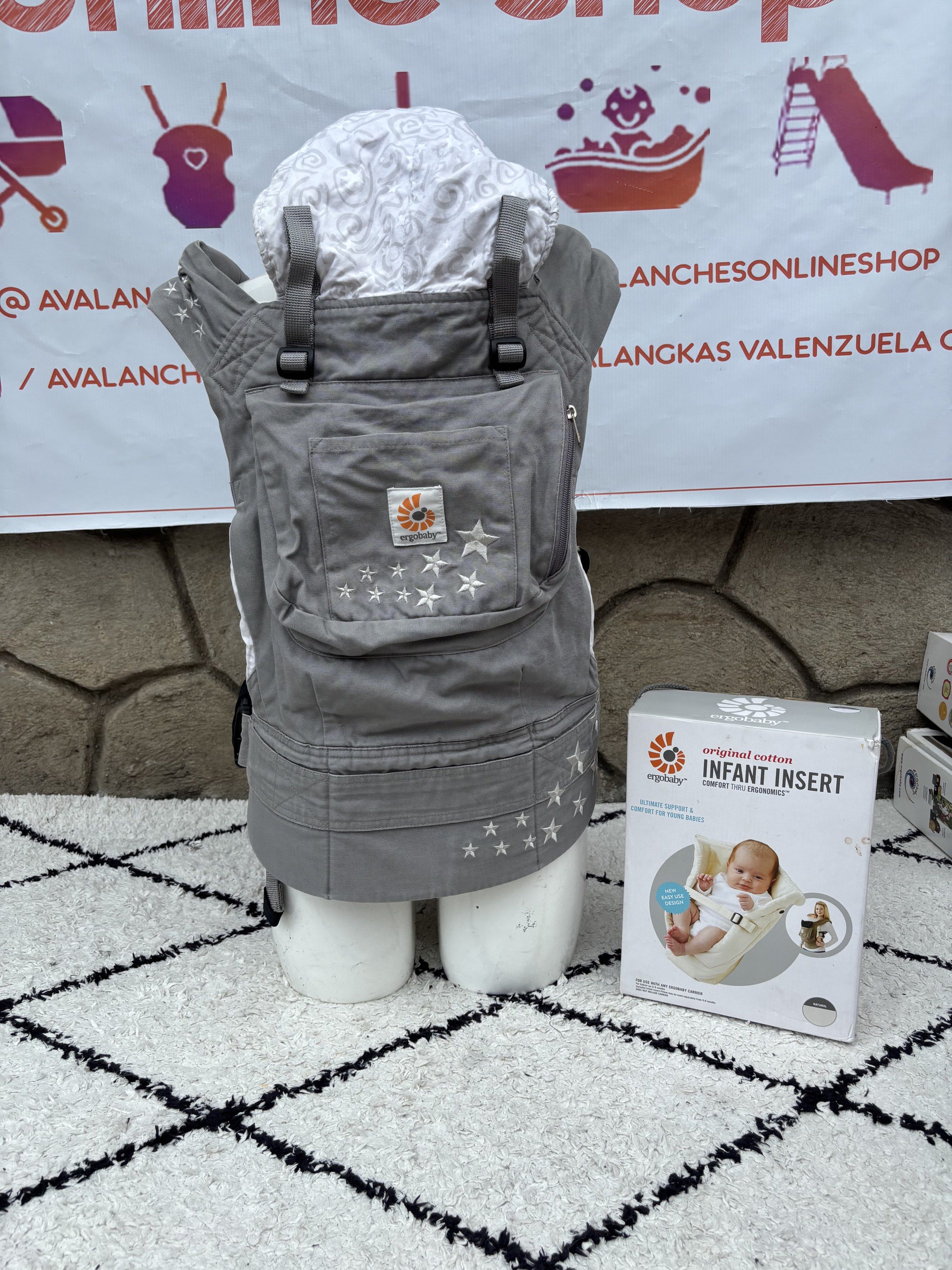 Ergobaby Original Baby Carrier with Infant Insert (Category: Carriers & Slings) located in Manila. Submitted by avalanchesonlineshopmainacount (Listing ID 1421237683, Image 1). Description: - Ergobaby Original baby carrier (gray with star design) - Includes infant insert (new in packaging) - Carrier has a hood - Perfect for keeping your baby close and comfortable.