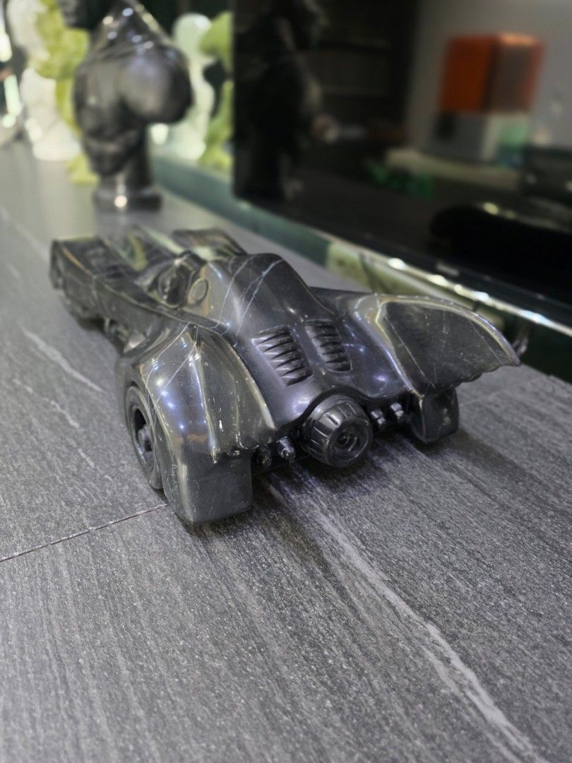 Hand Carved 1989 Batman Batmobile in Solid Nero Marquina Marble (Category: Vehicle & Diecast Models) located in Mandaluyong City. Submitted by lbear29 (Listing ID 1421130612, Image 2). Description: Hand carved from a single block of marble with exceptional details - Collector's item - One of a kind Marble fan art - Batmobile collectible - Sleek, dark design - Intricate detailing - Iconic Batmobile shape - Visible wheels and aerodynamic features -