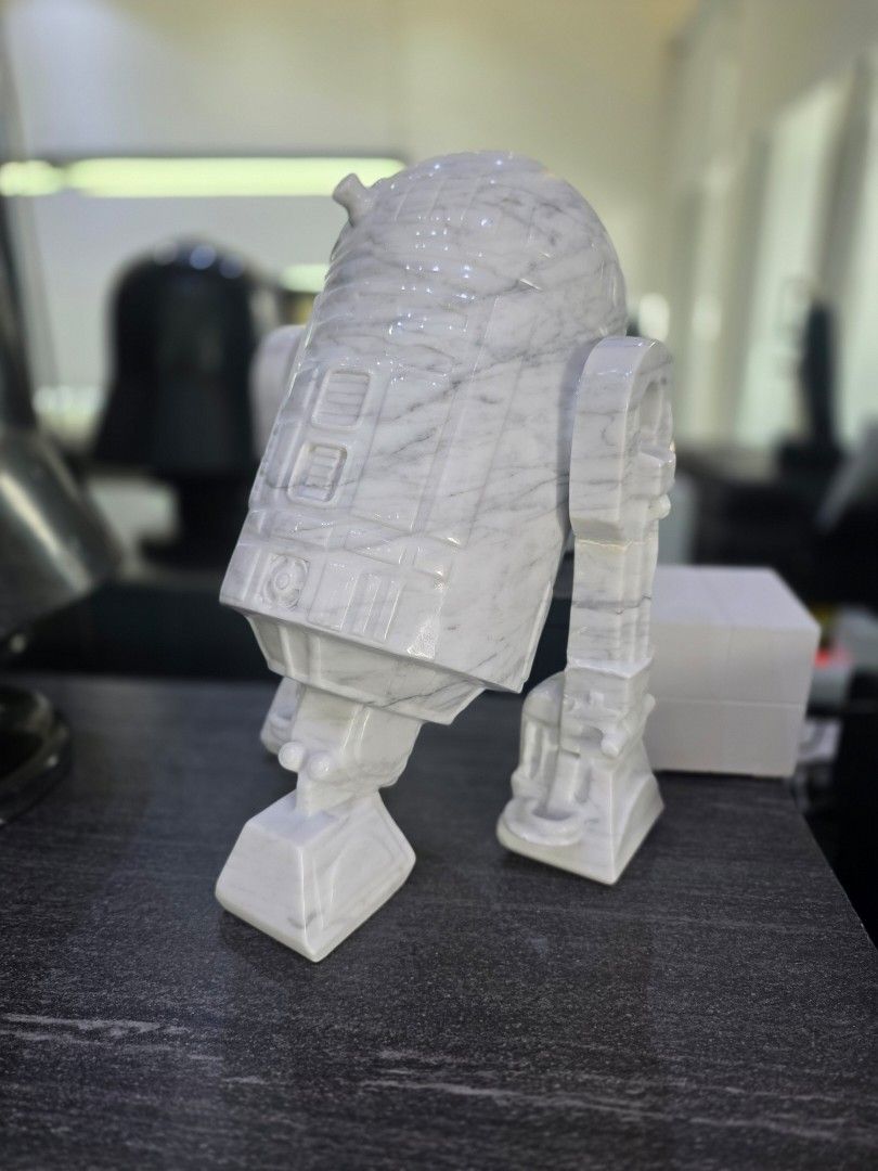Hand carved R2-D2 Figure in Solid White Carrara Marble (Category: Vintage Collectibles) located in Mandaluyong City. Submitted by lbear29 (Listing ID 1421131639, Image 2). Description: Hand carved from a single block of marble with exceptional details - Collector's item - One of a kind Marble fan art - R2-D2 figure - Crafted from solid white marble - Features detailed carvings - Perfect for Star Wars collectors - Unique and eye-catching piece - P