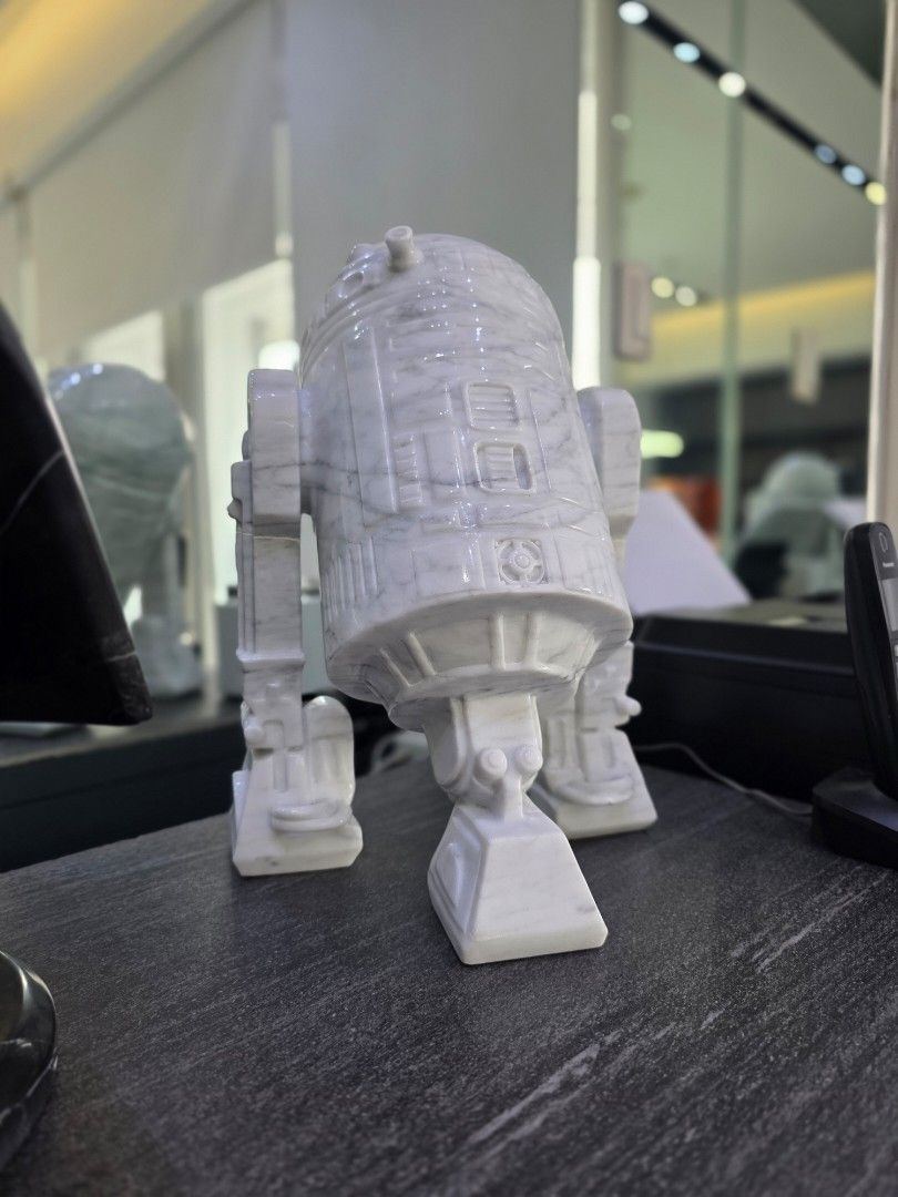 Hand carved R2-D2 Figure in Solid White Carrara Marble (Category: Vintage Collectibles) located in Mandaluyong City. Submitted by lbear29 (Listing ID 1421131639, Image 3). Description: Hand carved from a single block of marble with exceptional details - Collector's item - One of a kind Marble fan art - R2-D2 figure - Crafted from solid white marble - Features detailed carvings - Perfect for Star Wars collectors - Unique and eye-catching piece - P