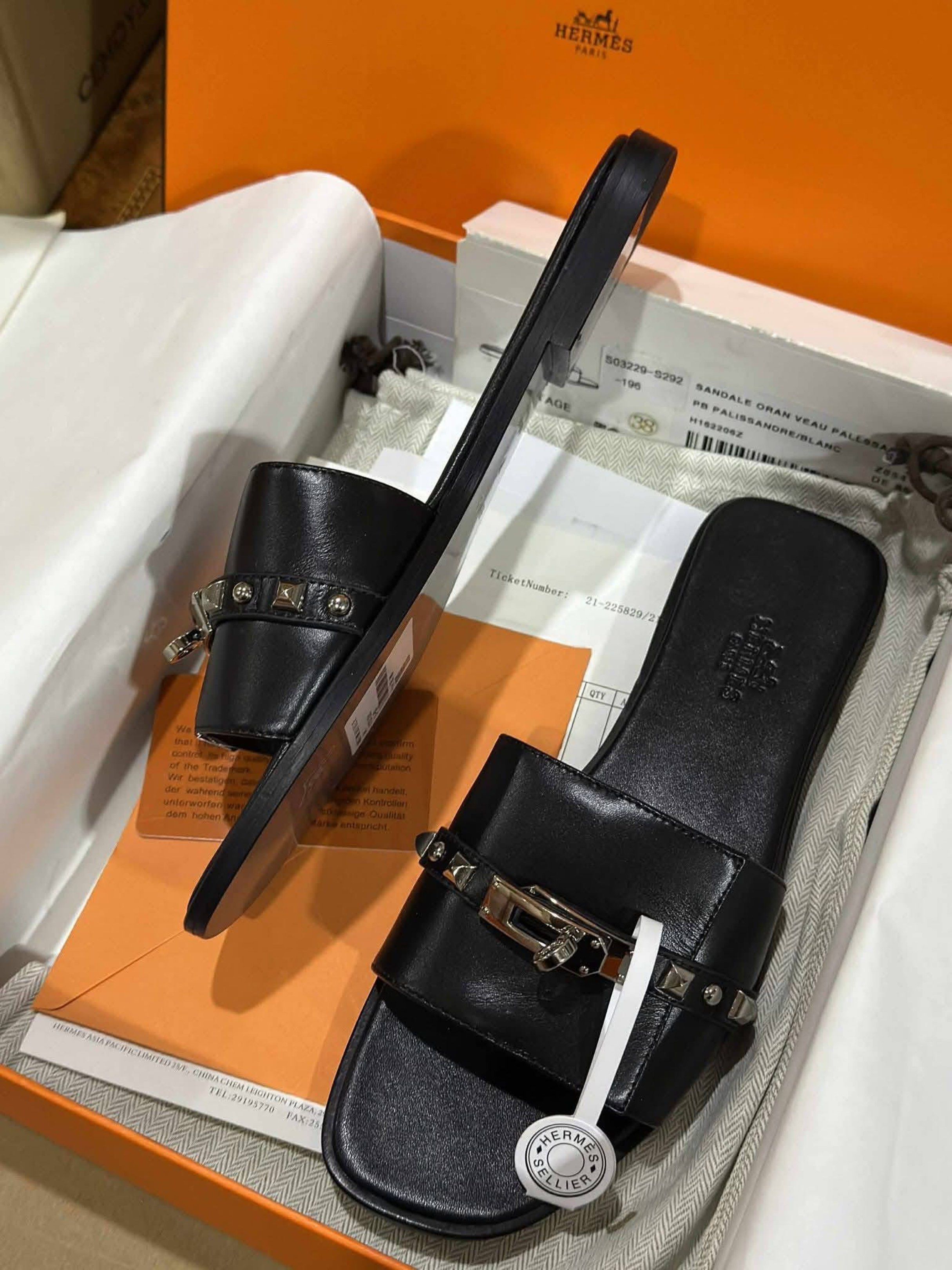 Hermes Oran Veau Pallisandre Sandals (Category: Sneakers & Footwear) located in Manila. Submitted by rosmiemuno16247 (Listing ID 1421155655, Image 2). Description: - Authentic Hermes Oran sandals - Color: Black - Size: 38 - Features iconic buckle and studded details - Includes original box and packaging - Made in Italy - Stylish and comfortable.