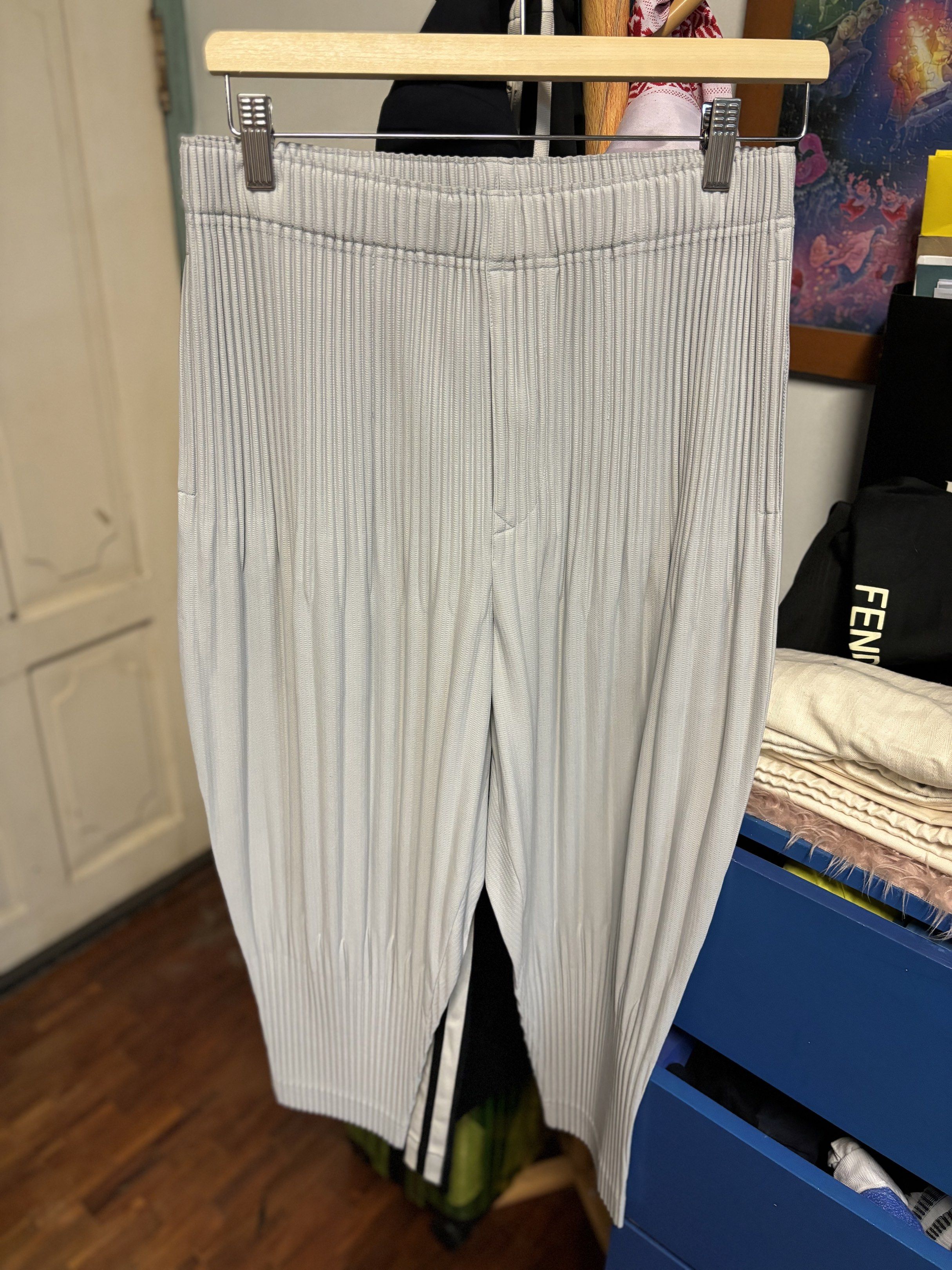 Homme Plisse Issey Miyake (Category: Trousers) located in Makati City. Submitted by tp8904 (Listing ID 1421286175, Image 2). Description: Homme Plissé Issey Miyake Cropped Pants – Light Gray (Never Used) • Brand: Homme Plissé Issey Miyake • Color: Light Gray • Size: 2 • Condition: Never used, excellent condition • Signature pleated fabric • Cropped length for a modern, tailored silhouette Iconic Homme Plissé pants known for comfort, flexibility, 