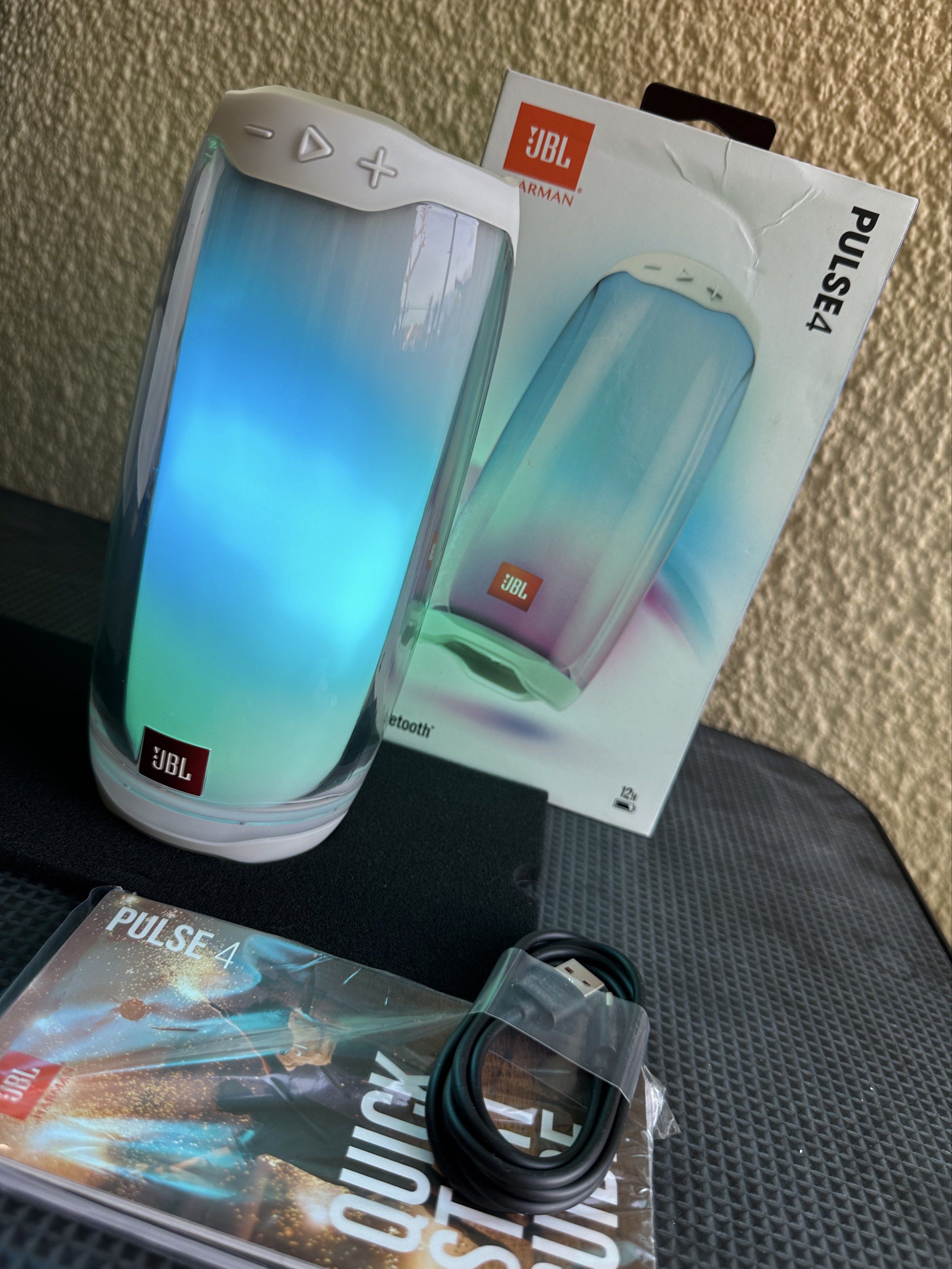 JBL Pulse 4 Bluetooth Speaker (Category: Soundbars, Speakers & Amplifiers) located in Paranaque City. Submitted by daluho.stuff (Listing ID 1421170989, Image 2). Description: - Original JBL Pulse 4 Bluetooth speaker - Includes original box - Comes with USB charging cable - Includes quick start guide - Features a unique light show - White color - Portable speaker - Bluetooth connectivity - JBL logo.