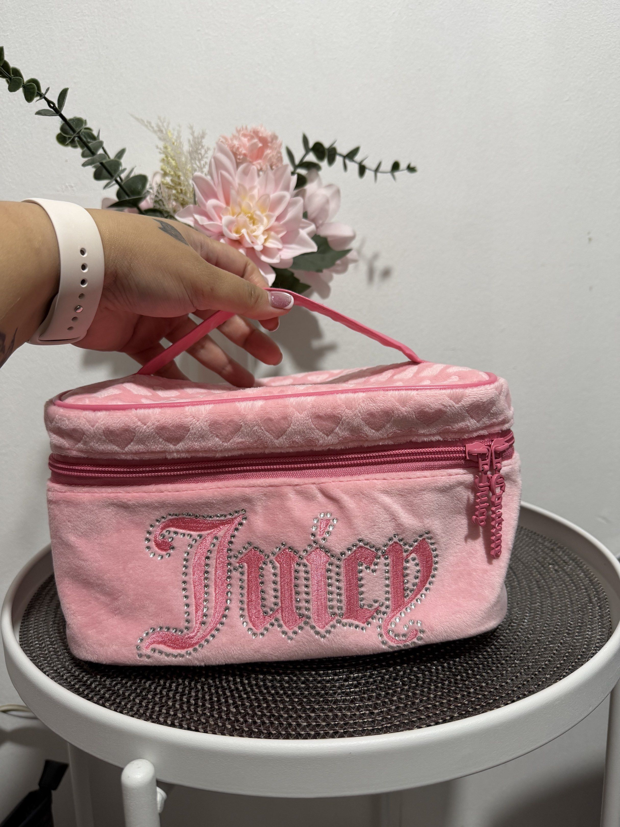 Juicy Couture Pink Cosmetic Bag (Category: Purses & Pouches) located in Las Pinas. Submitted by annberin (Listing ID 1421272212, Image 1). Description: - Authentic Juicy Couture cosmetic bag - Features a rhinestone-studded logo - Soft, velvety material - Adorable heart pattern on top - Convenient top handle - Secure zipper closure - Perfect for makeup and essentials No copyright infringement intended. I do not own this product.