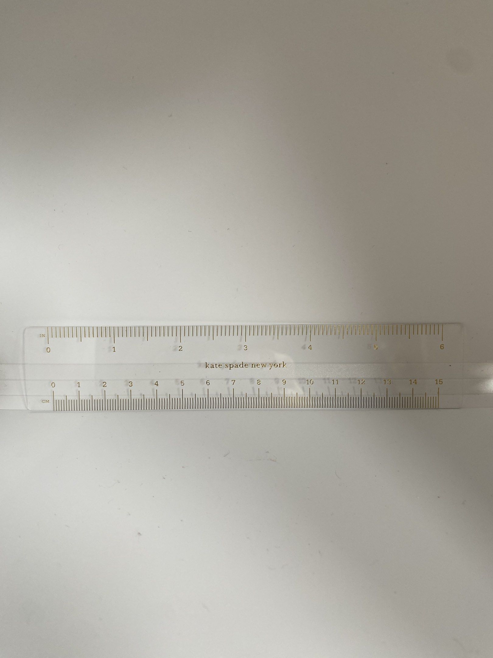 Kate Spade New York Flexible Plastic Ruler (Category: Stationery & School Supplies) located in Puerto Princesa. Submitted by kanejela (Listing ID 1421178539, Image 3). Description: - Kate Spade New York ruler - Measures up to 15 cm - Features gold markings - Includes the Kate Spade New York logo - Made of clear plastic material - Ideal for school, office, and crafting.