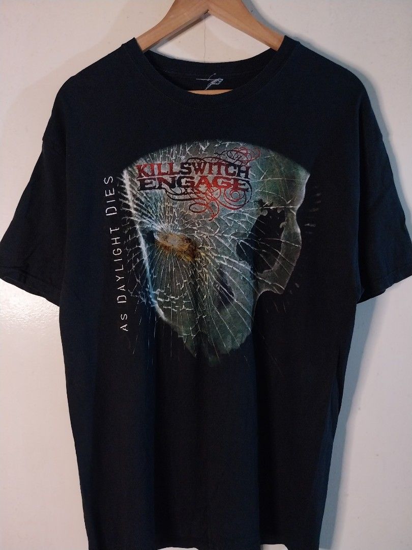 Killswitch Engage As Daylight Dies Band Tee shirt Licensed and dated (Category: Tshirts & Polo Shirts ) located in Zamboanga. Submitted by thekeepersph (Listing ID 1421225026, Image 1). Description: - Killswitch Engage t-shirt - Features "As Daylight Dies" album art - Black crew neck - Red and white band name print - Shirt is on a wooden hanger.