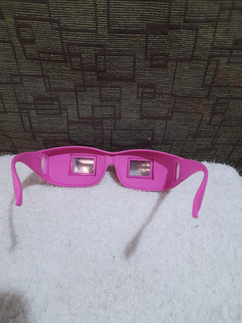 Laying in Bed Prism Eyeglasses (Category: Sunglasses & Eyewear) located in Bocaue. Submitted by marajapansurplus (Listing ID 1421167155, Image 3). Description: - Pink horizontal reading glasses - Designed for reading or watching TV in a reclined position - Unique prism design redirects vision downwards - Comfortable to wear while lying down - Ideal for bed or couch use.