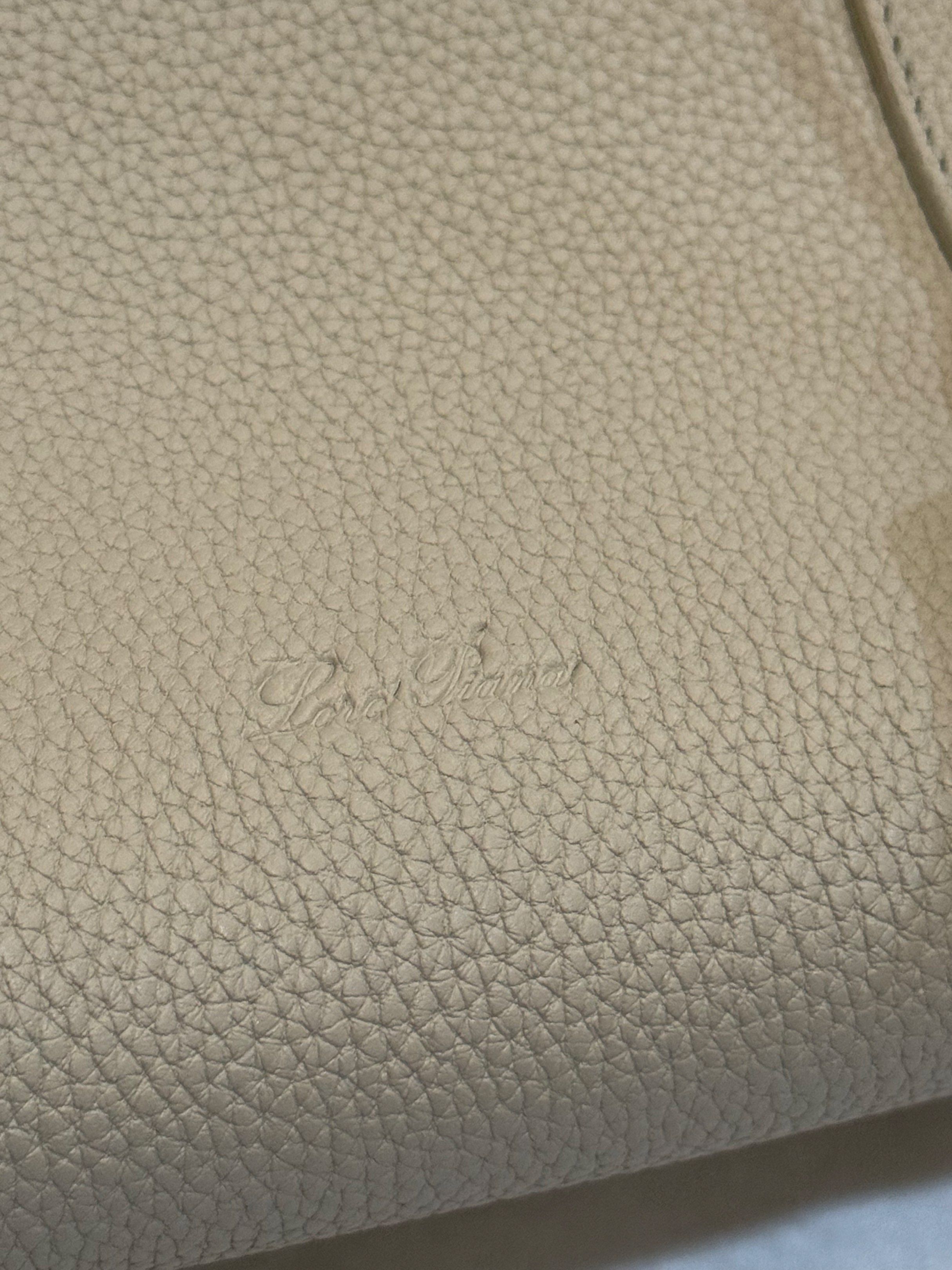 Loro Piana L32 Loom Handbag (Category: Shoulder Bags) located in Cebu City. Submitted by refabph (Listing ID 1421162721, Image 2). Description: Loro Piana Loom L32 Bag crafted from grained calfskin leath - Elegant top handle design. - Secure lock closure. - Features the Loro Piana logo. - Includes a detachable leather tag. - Interior pocket for organization. - Japan second hand/ preloved.