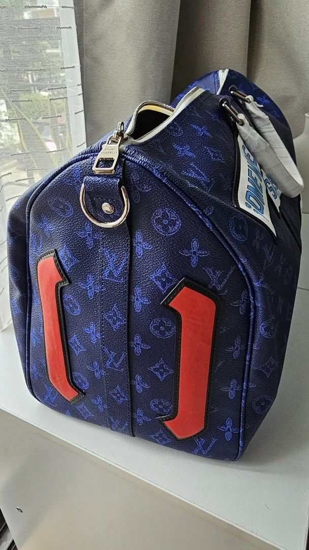 Louis Vuitton Duffle Bag Somewhere Somehow (Category: Luxury Bags & Wallets) located in Caloocan City. Submitted by marie_0812 (Listing ID 1421156915, Image 2). Description: - Louis Vuitton duffle bag - Spring/Summer 2021 collection - Navy blue monogram design with white accents - Features "SOMEWHERE SOMEHOW" patches - Detachable shoulder strap included - Spacious interior - Secure zipper closure - Gold hardware - Louis Vuitton Paris label inside