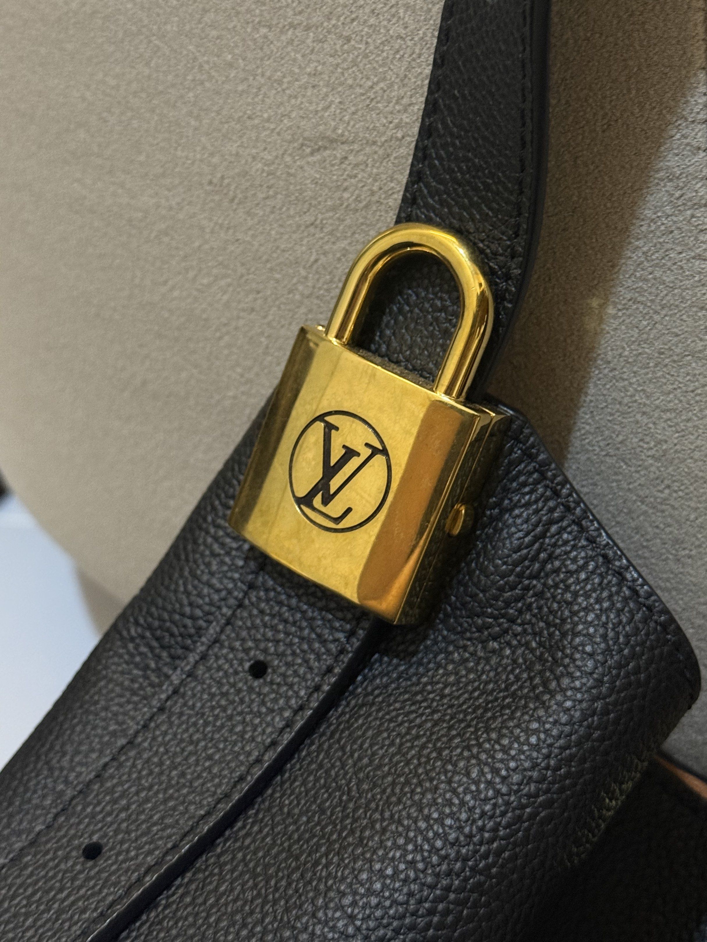 LV Low Key Hobo bag (Category: Tote Bags) located in Cebu City. Submitted by refabph (Listing ID 1421161517, Image 3). Description: Louis Vuitton Low Key Hobo bag - Black leather exterior - Gold-tone hardware and padlock - Includes small pouch with LV monogram - Light brown interior - Made in Spain - Second hand/ pre loved .