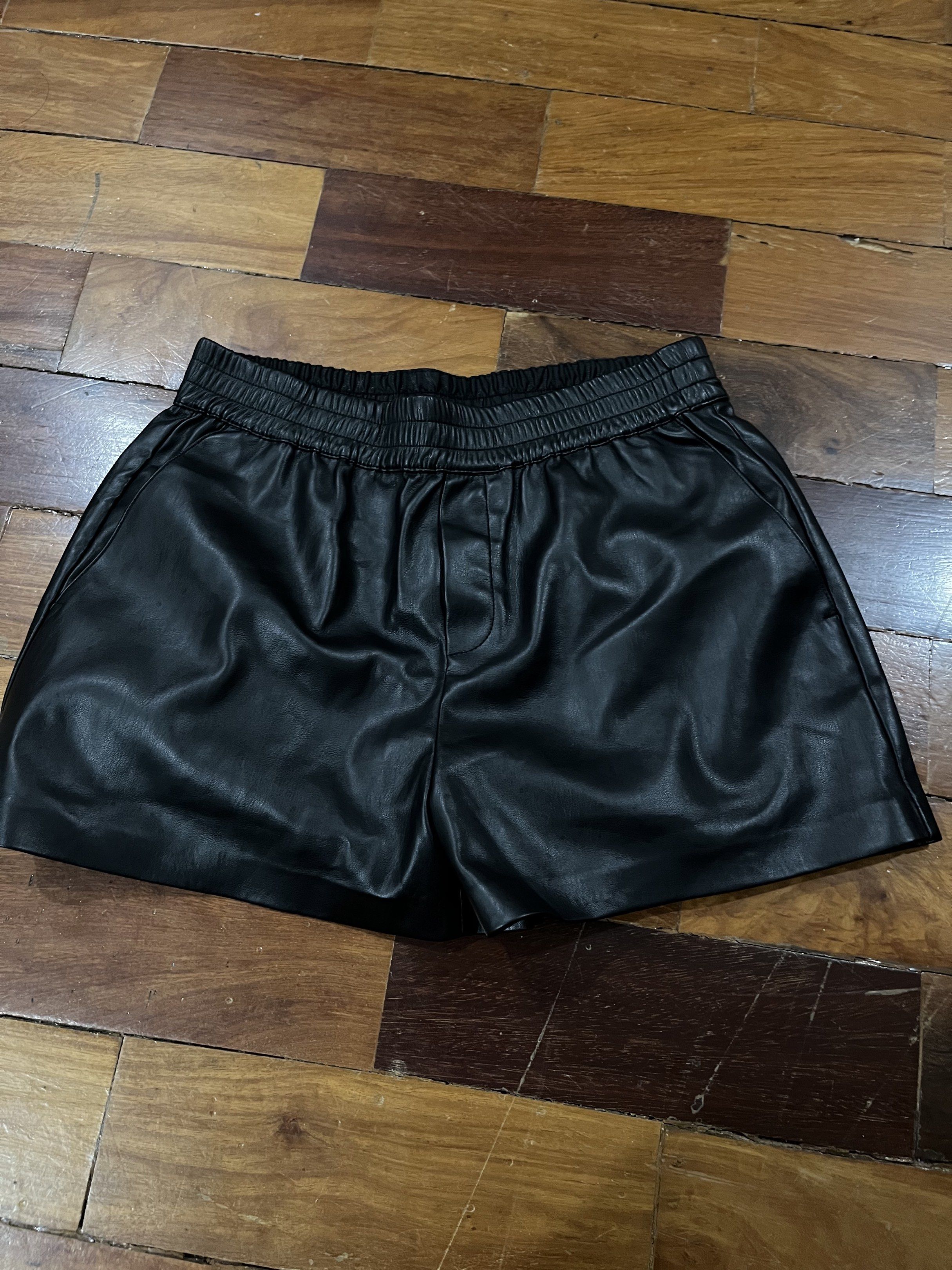 Mango Faux Leather Shorts - Size M (Category: Shorts) located in Paranaque City. Submitted by nikkis100 (Listing ID 1421258259, Image 1). Description: - Mango black faux leather shorts - Size: M - Used 3 times - Features an elastic waistband - Includes two back pockets - Perfect for casual or dressy outfits - Comfortable and easy to wear RFS: I don’t get to use it often .