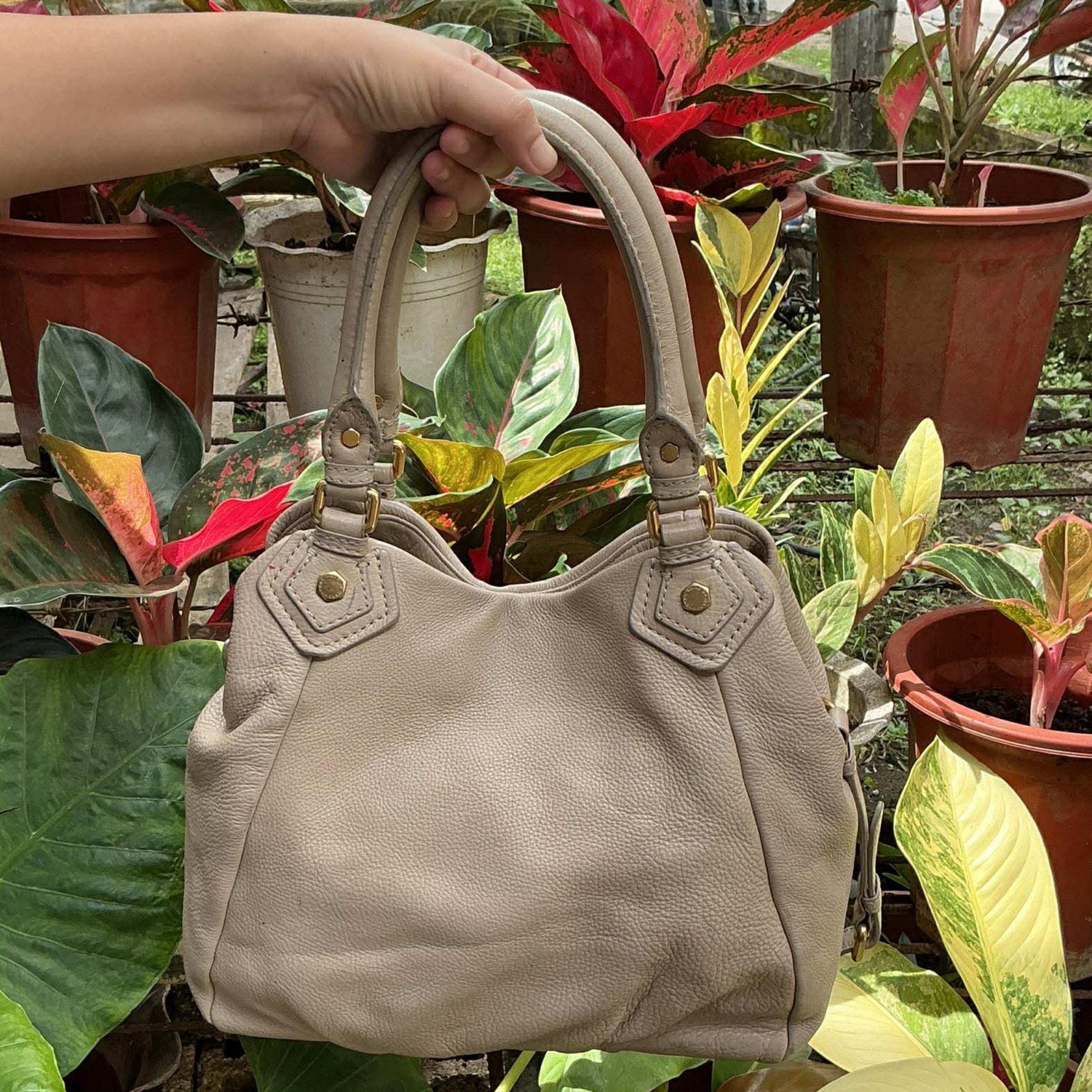 Marc by Marc Jacobs Hobo Bag (Category: Luxury Bags & Wallets) located in Tagbilaran City. Submitted by Bunnybebu (Listing ID 1419684553, Image 2). Description: Authentic Marc Jacobs Large size Actual color: Cream/Beige With signs of use (check all photos) 📍Tagbilaran City, Bohol ⚠️ This is a thrifted item so please manage your expectations. ❎ Bawal sa maselan at maarte ‼️All sales are final. ‼️ ❌ No return, no exchange ✅ FULL PAYMENT FIRST befo