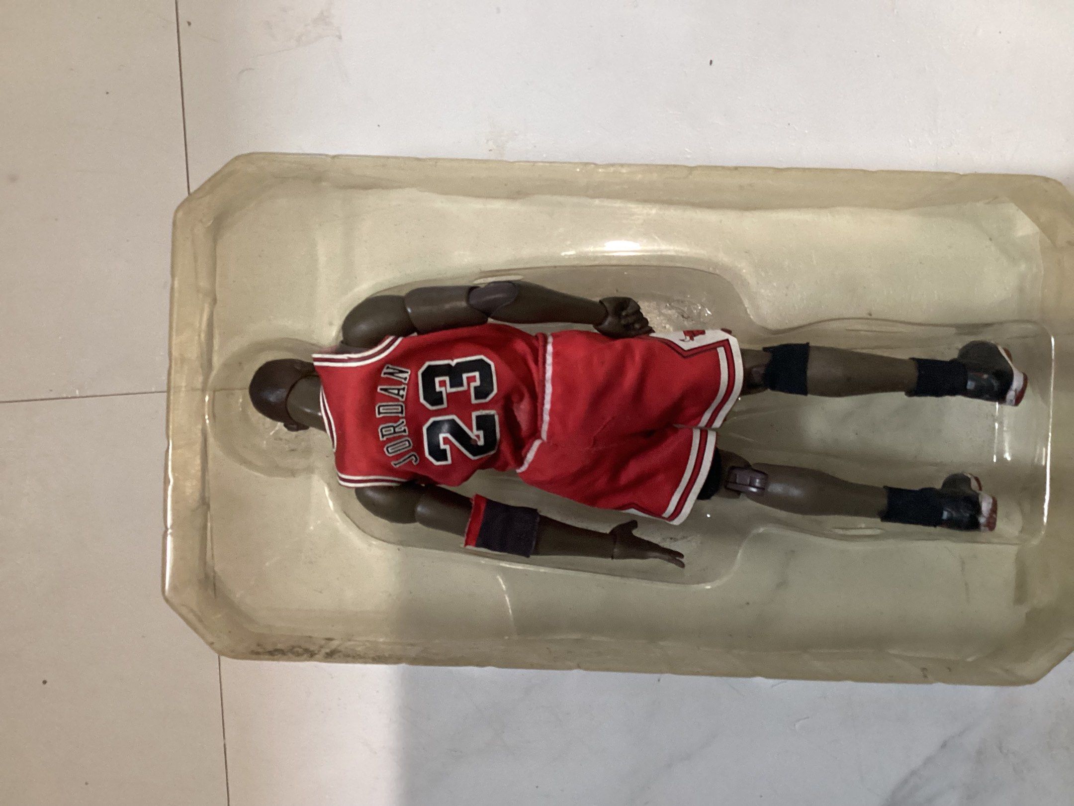 Michael Jordan Chicago Bulls Action Figure (Category: Figurines & Statues) located in Manila. Submitted by cozenn (Listing ID 1421147928, Image 2). Description: - Michael Jordan action figure - Chicago Bulls uniform (Number 23) - Includes interchangeable hands - Comes with a basketball - Features a Chicago Bulls logo - Includes a stand - In original packaging.