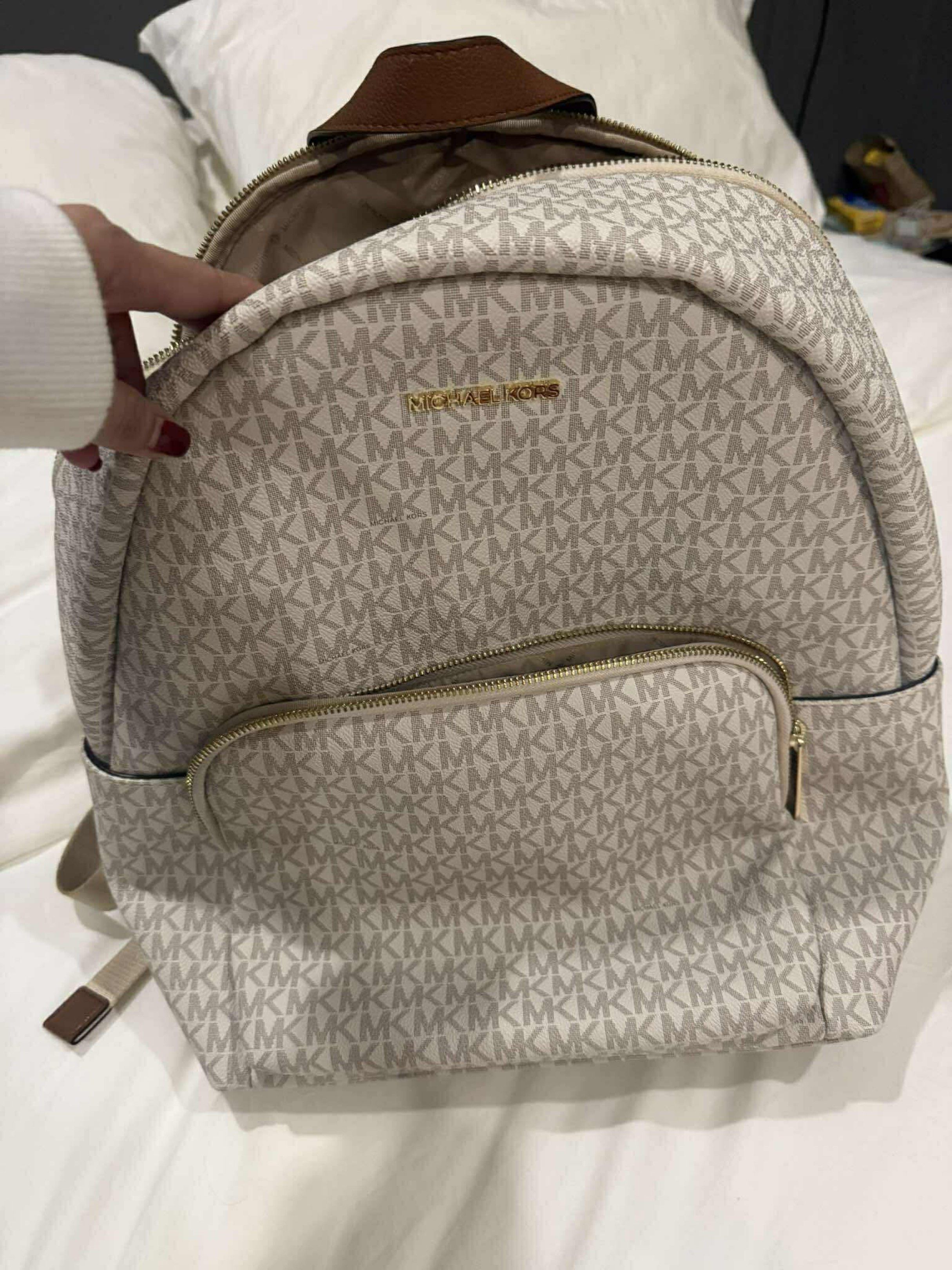Michael Kors Bundle set (Backpack and Tote Bag) (Category: Luxury Bags & Wallets) located in Manila. Submitted by glazelpagk55092 (Listing ID 1421167411, Image 1). Description: Original MK Backpack and Tote Bag: take all 5k only - Michael Kors Backpack: - MK logo pattern - Front pocket - Top handle - Michael Kors Handbag: - Light pink color - Shoulder strap - MK logo charm - Both bags: - Gold-tone hardware.