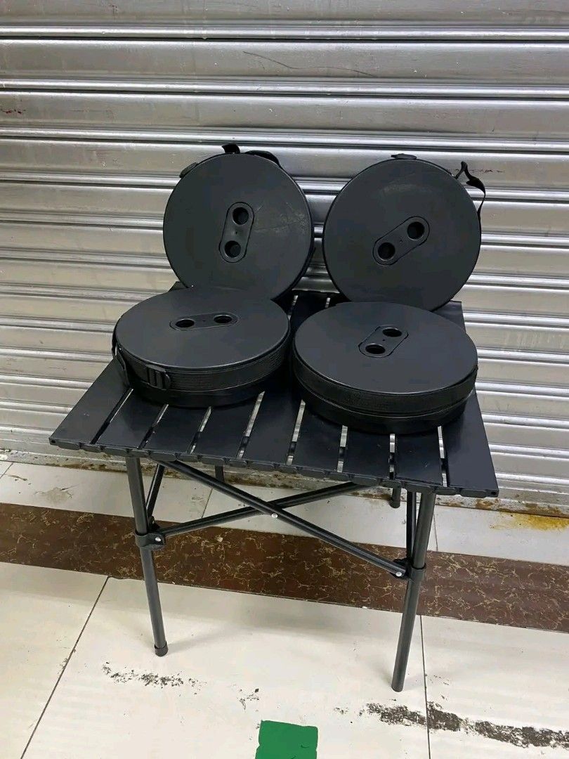 Portable Folding Table and Stools Set (Category: Tables & Sets) located in Quezon City. Submitted by anghies_shop (Listing ID 1421258960, Image 2). Description: - Black folding table with slatted design - Foldable legs for easy storage - Includes 4 matching black retractable stools - Compact and easy to store stools - Ideal for outdoor activities and small spaces.