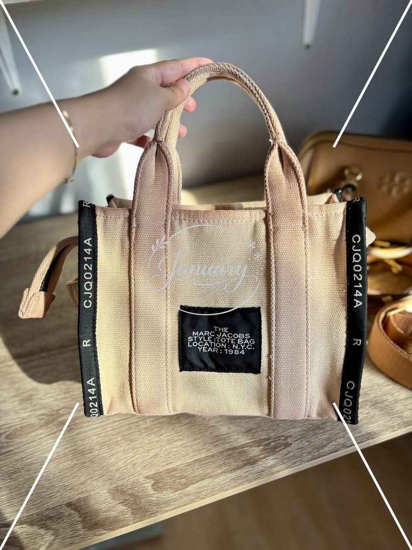 Preloved Marc Jacobs The Tote Bag in mini (Category: Luxury Bags & Wallets) located in Naguilian. Submitted by MyJanuary (Listing ID 1421235877, Image 2). Description: 💯Authentic Marc Jacobs The Tote Bag Selling low because it doesn't include any straps. What you see is what you get. Flaw is already posted - discoloration It is clean and ready to use. Mini in size. Loc: La Union MoP: Gcash MoD: LBC or Jnt - but I prefer LBC kasi it's safer.