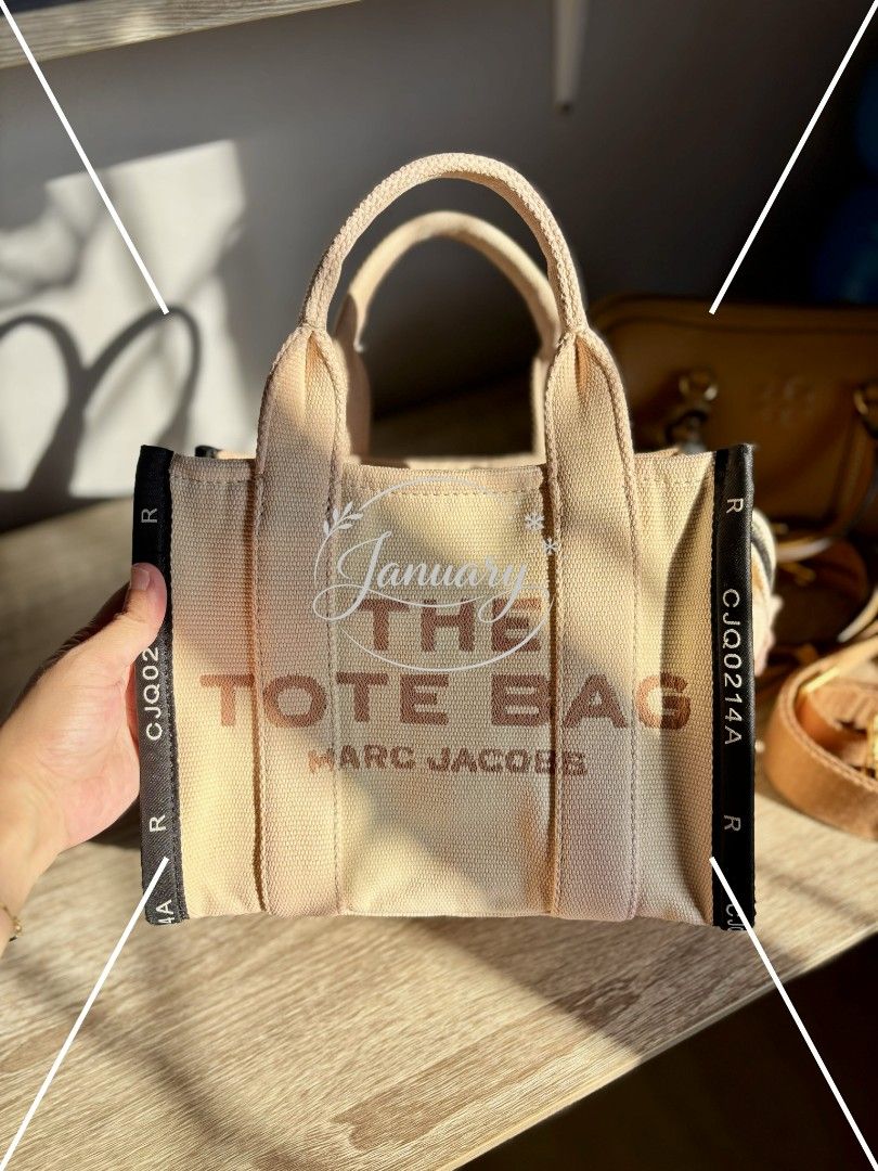 Preloved Marc Jacobs The Tote Bag in mini (Category: Luxury Bags & Wallets) located in Naguilian. Submitted by MyJanuary (Listing ID 1421235877, Image 1). Description: 💯Authentic Marc Jacobs The Tote Bag Selling low because it doesn't include any straps. What you see is what you get. Flaw is already posted - discoloration It is clean and ready to use. Mini in size. Loc: La Union MoP: Gcash MoD: LBC or Jnt - but I prefer LBC kasi it's safer.