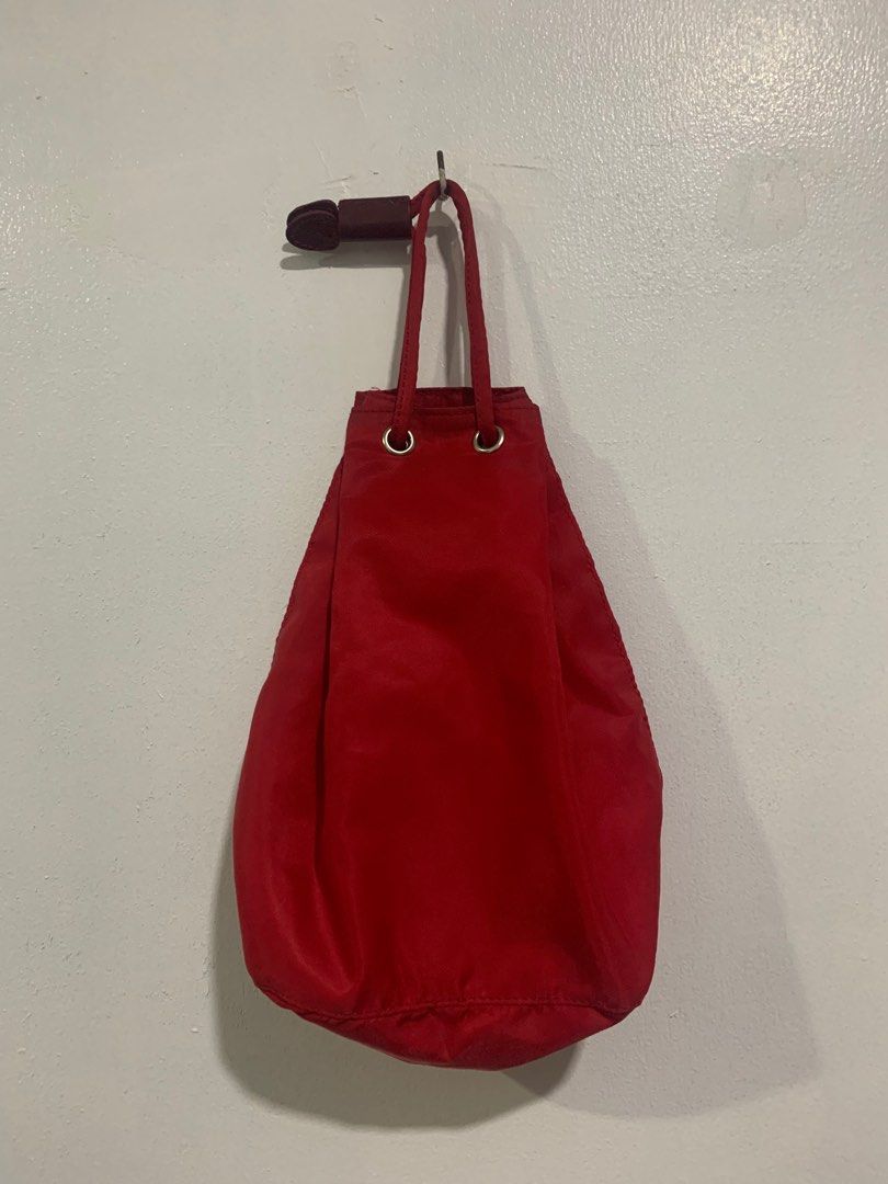 RED PRADA DRAWSTRING POUCH (Category: Luxury Bags & Wallets) located in Cebu City. Submitted by fierce.vincent (Listing ID 1421227766, Image 2). Description: RED PRADA DRAWSTRING POUCH LIGHTLY USED / NO ISSUE + SF.