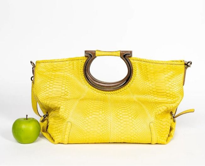 NEGOTIABLE! Salvatore Ferragamo Python Fiammetta Shoulder Bag Spring/Summer Coll 2010 (Category: Luxury Bags & Wallets) located in Cainta. Submitted by ahyish (Listing ID 1421164538, Image 1). Description: - Bright yellow leather handbag - Unique wooden handle - Detachable shoulder strap - Textured, snakeskin-like pattern - Silver-tone hardware - Spacious design - Suitable for everyday use .
