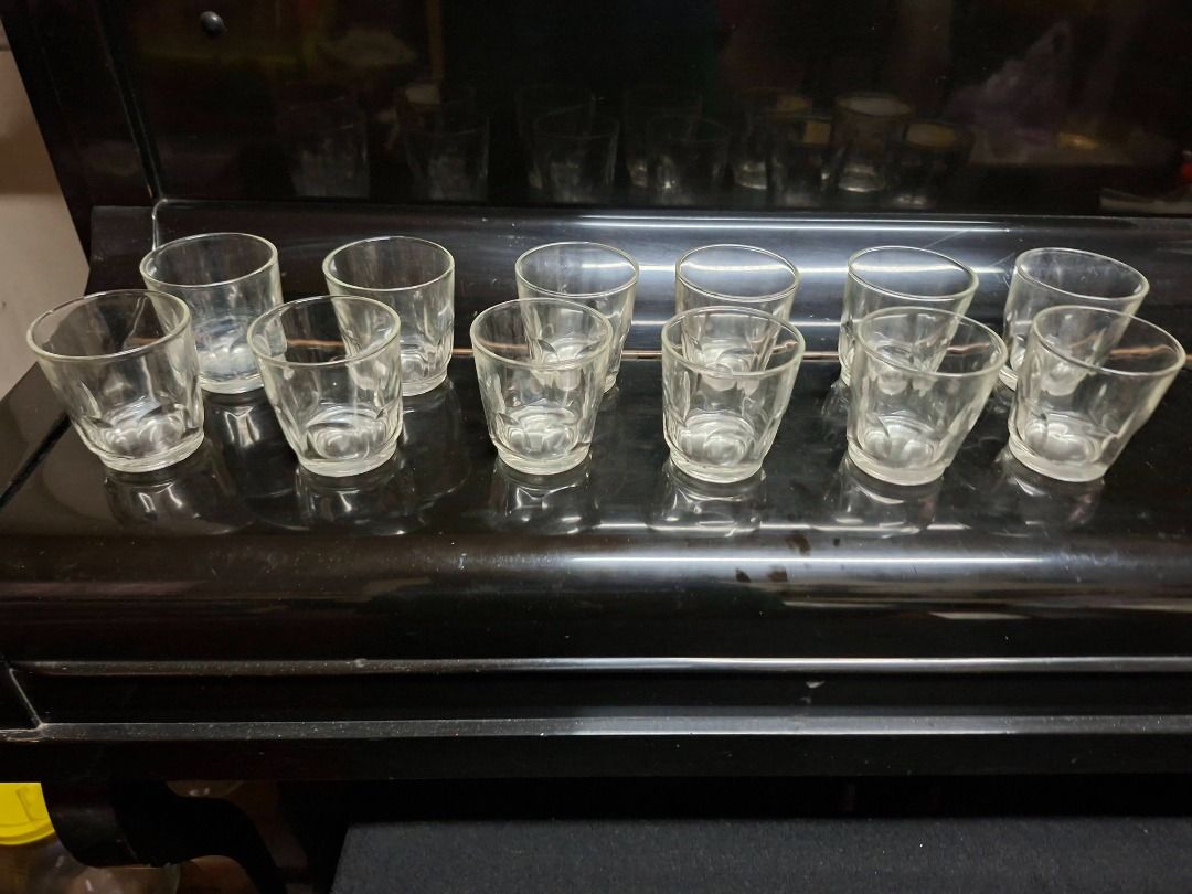 Set of Drinking Glasses (12pcs) (Category: Other Kitchenware & Tableware) located in Taguig. Submitted by d_man11 (Listing ID 1421215371, Image 3). Description: Set of Drinking Glasses (12pcs) - Set (12 pcs) of clear drinking glasses - Simple, classic design - Ideal for serving guests or daily use - No cracks, no scratches - Made of glass Dimensions: 7.3 cm tall, 7 cm circumference .