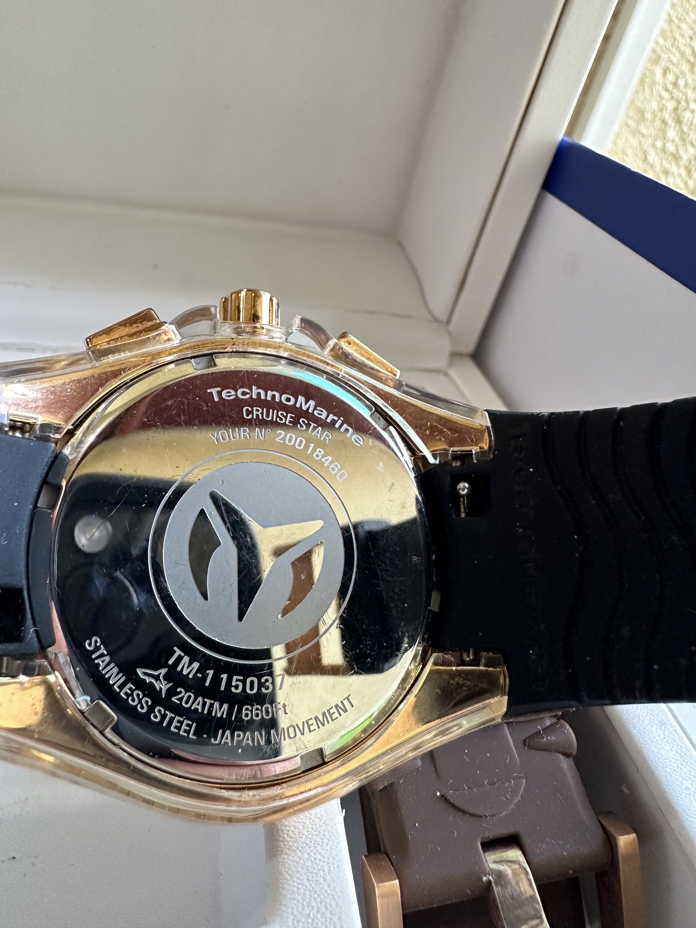 TechnoMarine Cruise Star Watch (Category: Men's Watches) located in Paranaque City. Submitted by daluho.stuff (Listing ID 1421175321, Image 3). Description: TechnoMarine Cruise Star watch with a black dial and gold-tone bezel. Includes two additional straps: white and brown. The watch features a black rubber strap and comes with its original box. The back of the watch indicates it is stainless steel and has a Japan movement..