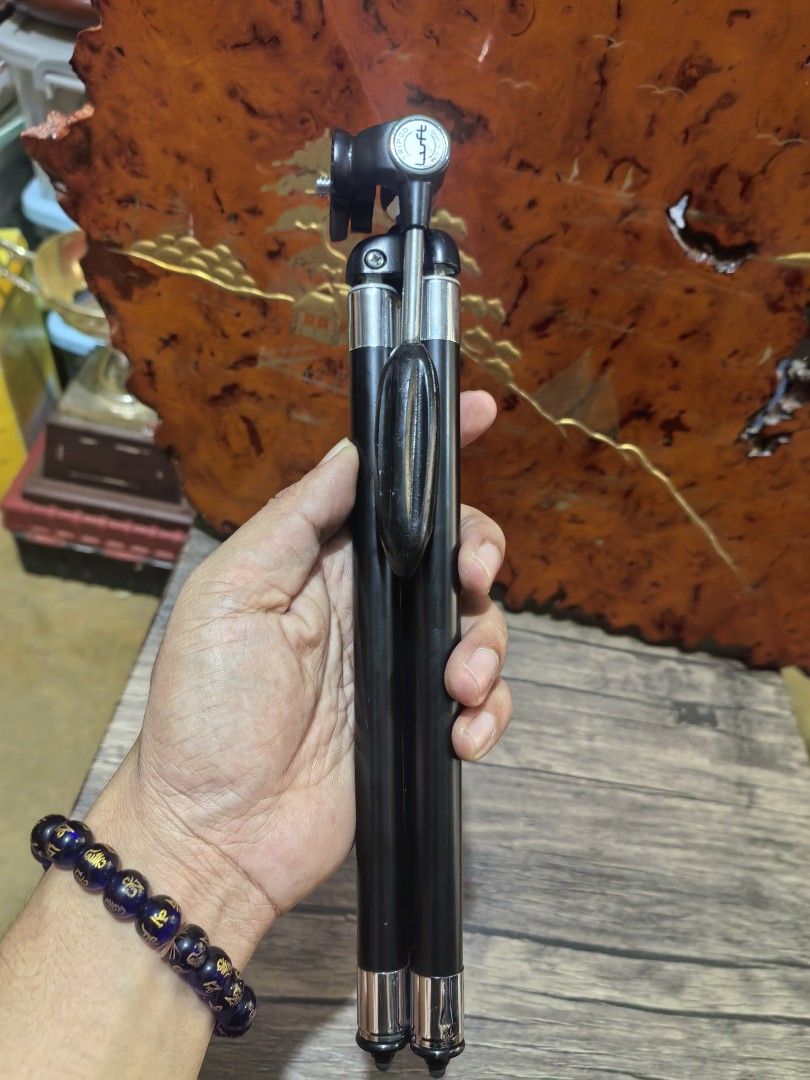 Tripod - Portable Camera Tripod (Category: Tripods & Monopods) located in Cebu City. Submitted by dudes_villanueva (Listing ID 1421137748, Image 2). Description: Tripod - Portable Camera Tripod Brand: Luft - Made in Japan 📌It has a black and silver telescopic design. 📌The legs fold together for a compact, handheld form factor. 📌Made of metal and possibly some plastic components. 📌It features a ball head mount for adjustable positioning. 📌In 