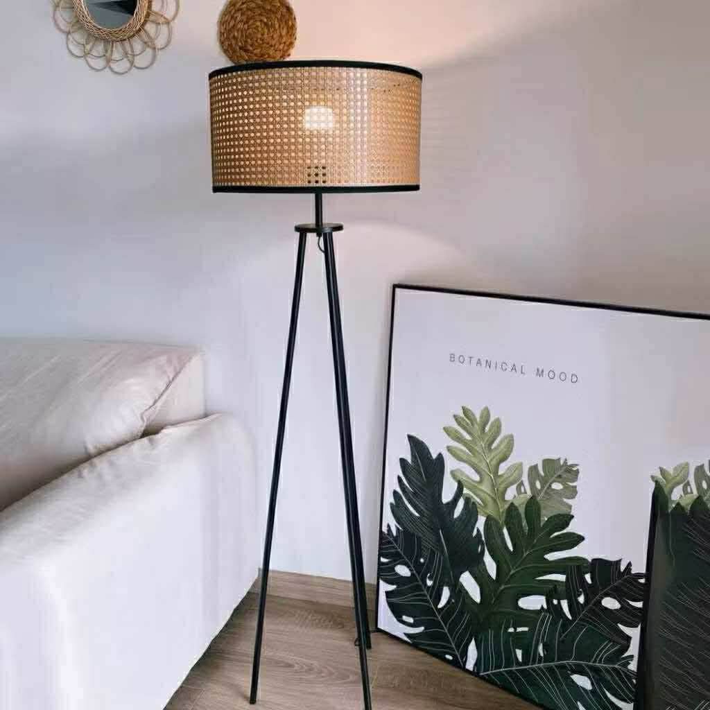 Tripod Floor Lamp with Rattan Shade (Category: Lighting) located in Makati City. Submitted by gineth24 (Listing ID 1421164389, Image 2). Description: - Stylish floor lamp with a black tripod base - Features a cylindrical rattan shade with a woven texture - Provides warm, ambient lighting - Ideal for living rooms and bedrooms - Dimensions: 150cm height, 42cm shade diameter, 23cm shade height.