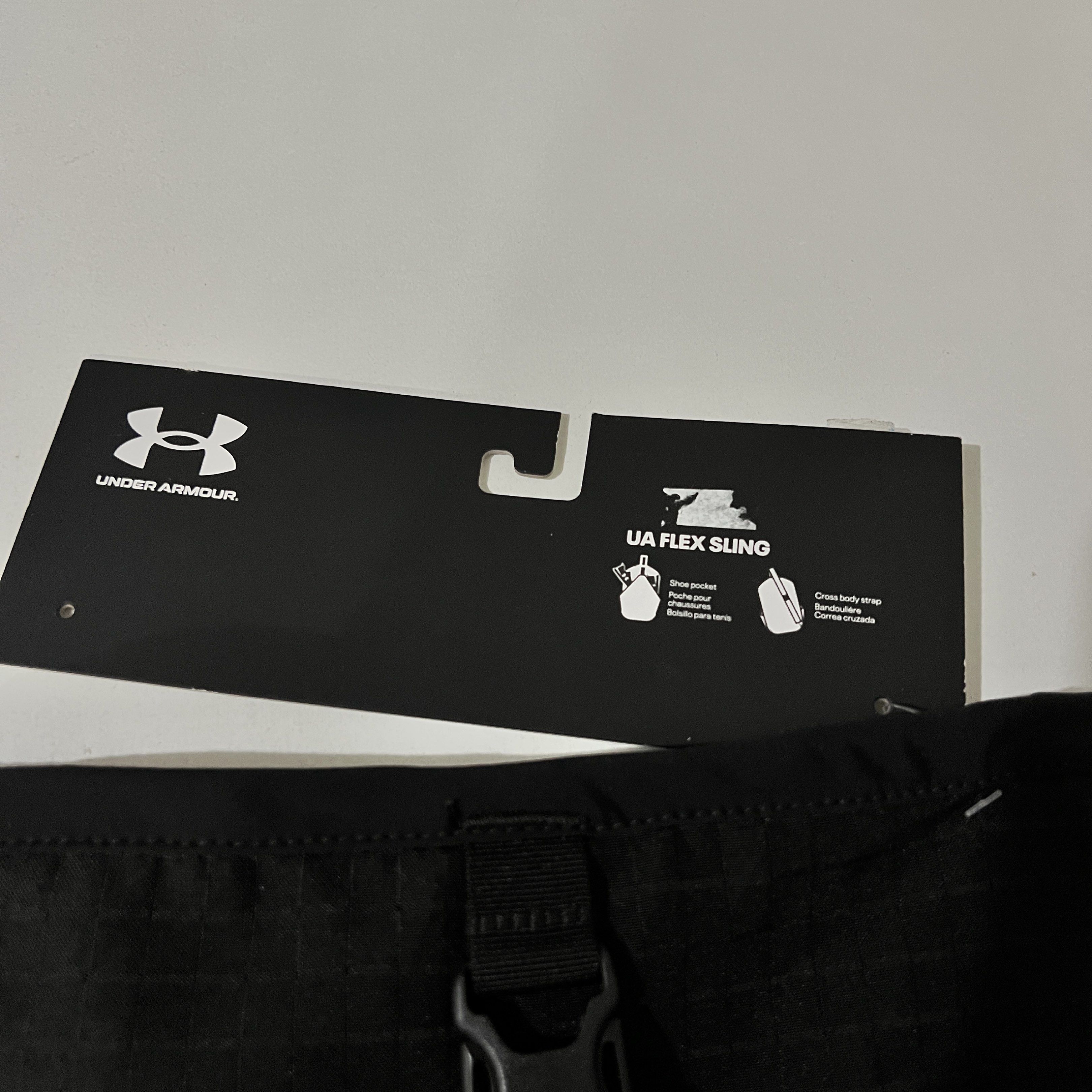 Under Armour UA Flex Sling Bag (Category: Sling Bags) located in Quezon City. Submitted by saayymm (Listing ID 1421249001, Image 2). Description: Under Armour UA Flex Sling Bag is perfect for carrying essentials. It features a shoe pocket, two deep water bottle pockets, and a cross-body strap. The bag is black with the Under Armour logo. It has a 15L capacity and dimensions of 44x27.6x11cm. .