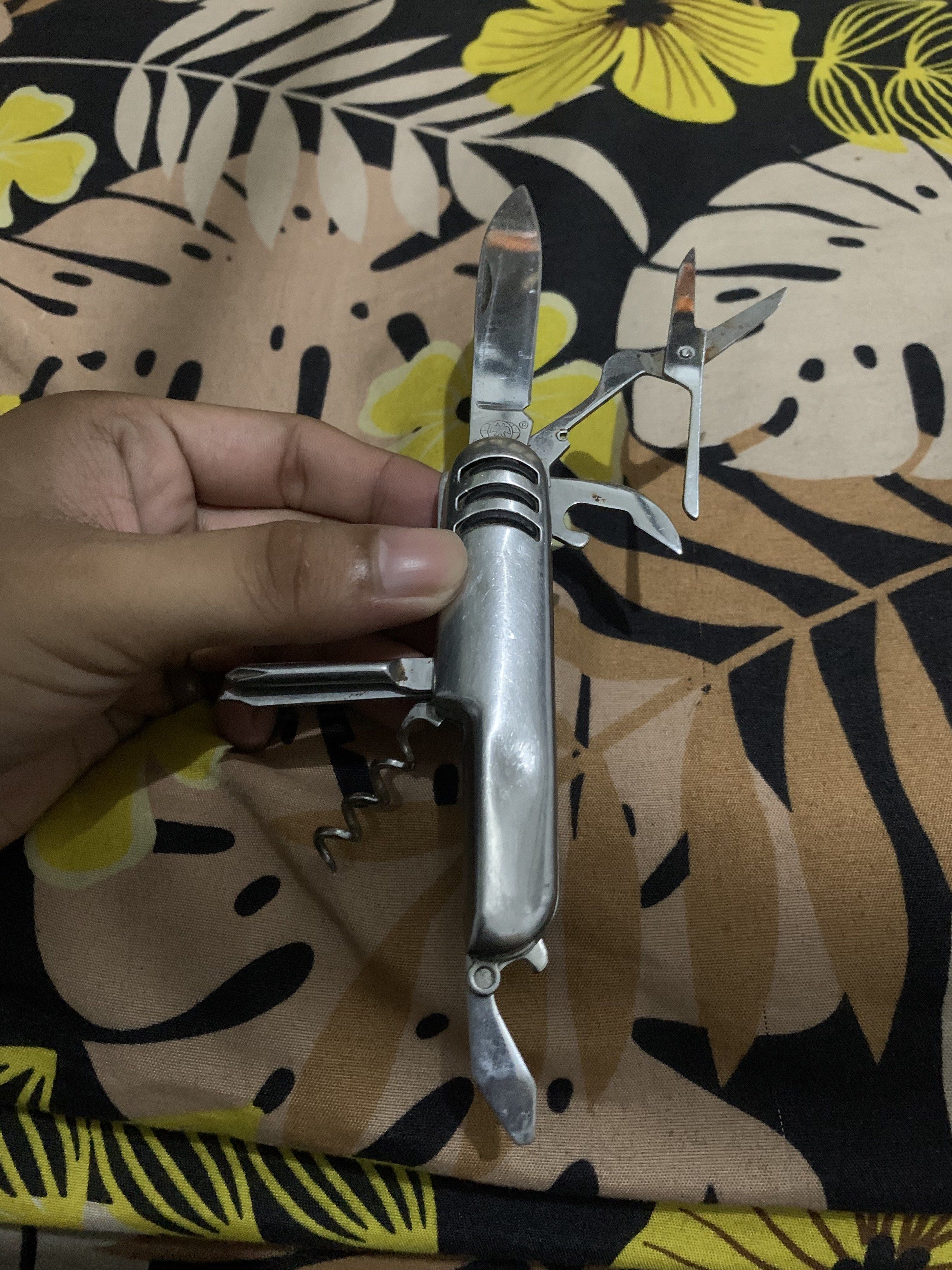 Vintage Multi-tool Knife (Category: Knives & Chopping Boards) located in Manila. Submitted by declutteringog7 (Listing ID 1421144042, Image 3). Description: - Multi-tool knife - Features: Knife blade, scissors, corkscrew, and more - Silver finish - Compact and easy to carry - Well-maintained - Functional for various tasks.