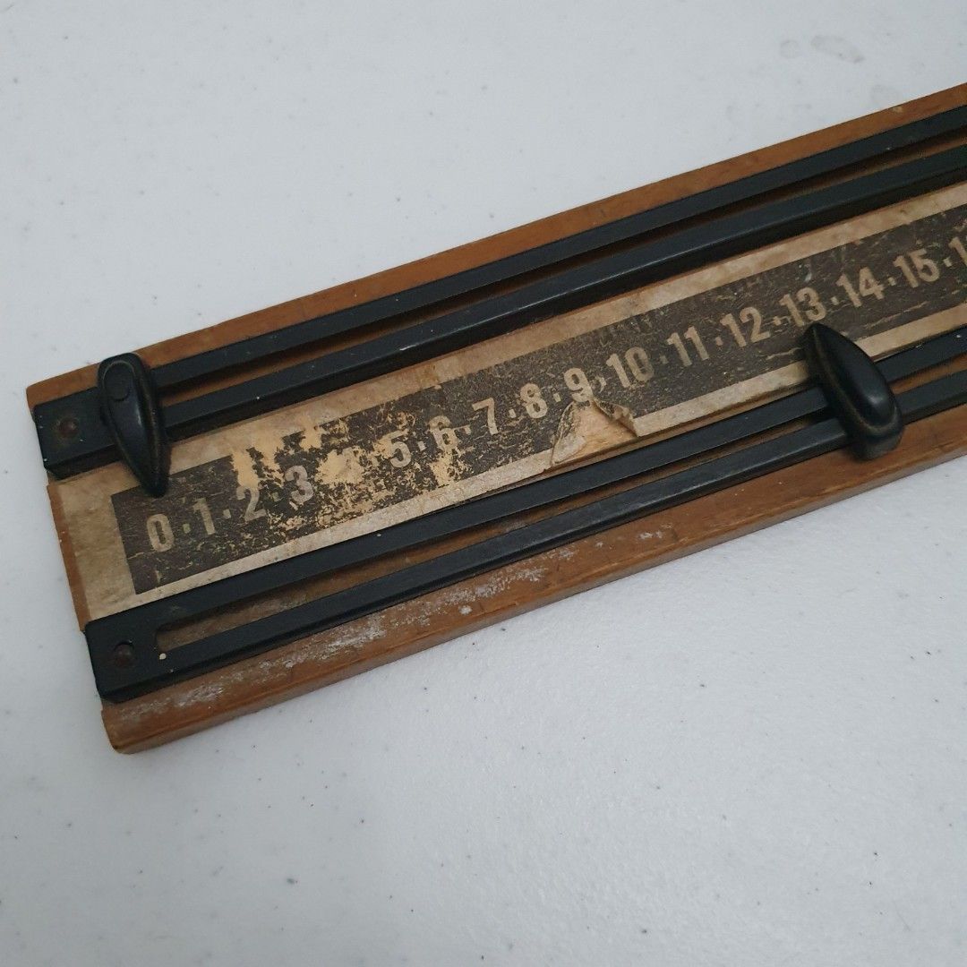 Vintage Slide scoring table (Category: Stationery & School Supplies) located in Paranaque City. Submitted by cobien (Listing ID 1421269003, Image 3). Description: Vintage slide rule with measurements in inches. It features a wooden frame with black plastic sliders and a paper scale. The scale includes numbers from 0 to 100. The slide rule measures approximately 11.9 x 2.70 inches..
