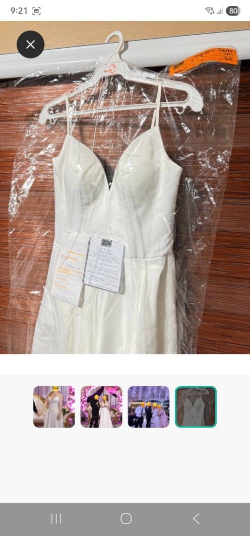 White Wedding Dress with Spaghetti Straps (Category: Dresses) located in Paranaque City. Submitted by declutterproject (Listing ID 1421125760, Image 2). Description: - Stunning white wedding dress - Features delicate spaghetti straps - Elegant V-neckline - Flowing skirt design - Crafted from a smooth, satin-like fabric - Comes with a protective garment bag - Ideal for weddings and special occasions.