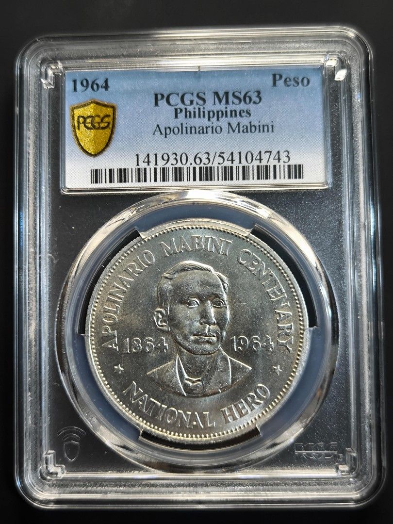 1964 Philippines Apolinario Mabini Centenary Silver Coin (Category: Currency) located in Paranaque City. Submitted by phcoincollective (Listing ID 1421322104, Image 1). Description: - 1964 Philippines Apolinario Mabini Centenary Silver Coin - Graded MS63 by PCGS - Features Apolinario Mabini on the obverse - Features the Central Bank of the Philippines seal on the reverse - Comes in a protective holder.