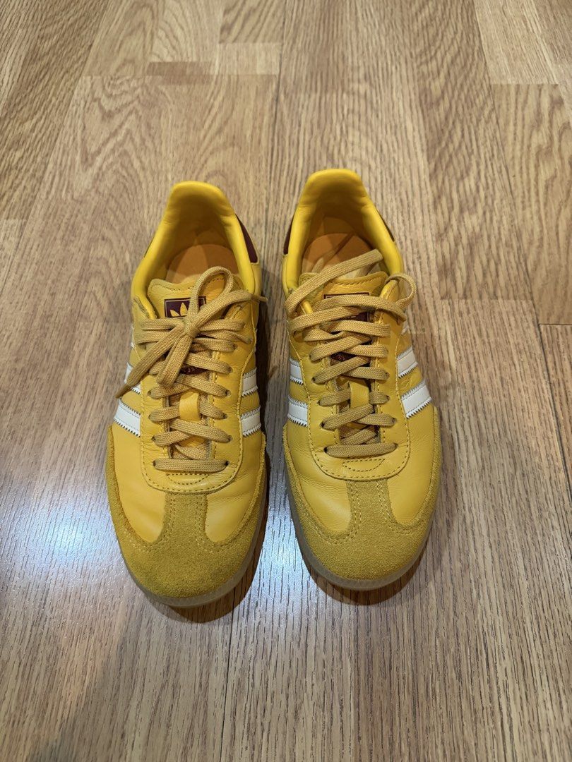 Adidas Samba OG Yellow Sneakers original (Category: Sneakers) located in Pasig City. Submitted by fz718 (Listing ID 1421338055, Image 1). Description: - Adidas Samba OG sneakers - Yellow with white stripes - Yellow suede toe cap - Burgundy heel tab - Yellow laces - Gum sole - Adidas logo on tongue.