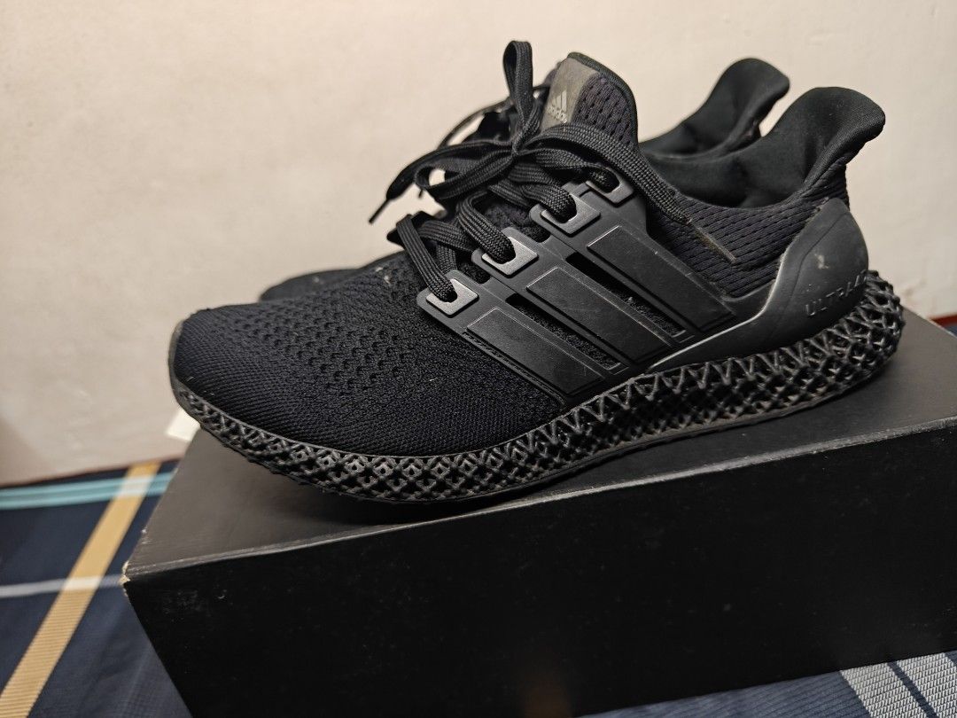 Adidas Ultraboost 4D Triple Black (Category: Sneakers) located in Quezon City. Submitted by zpl23 (Listing ID 1421312833, Image 3). Description: - Adidas Ultraboost 4D sneakers - Black color - Features the iconic three stripes and 4D midsole - Includes original box (Damaged) - Minor imperfection on the toe area - 9.5 good condition.
