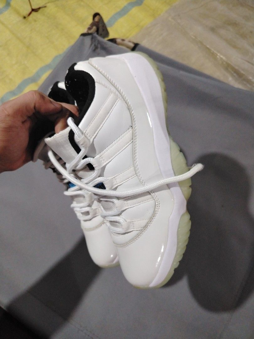 Air Jordan 11 Retro White/Legend Blue (Category: Sneakers) located in Midsalip. Submitted by shoesselector (Listing ID 1421393604, Image 3). Description: - Air Jordan 11 Retro - Colorway: White and Legend Blue - Features a white upper with patent leather overlay - Translucent outsole - Jumpman logo on the heel - Size: US 10 - Condition: Good.