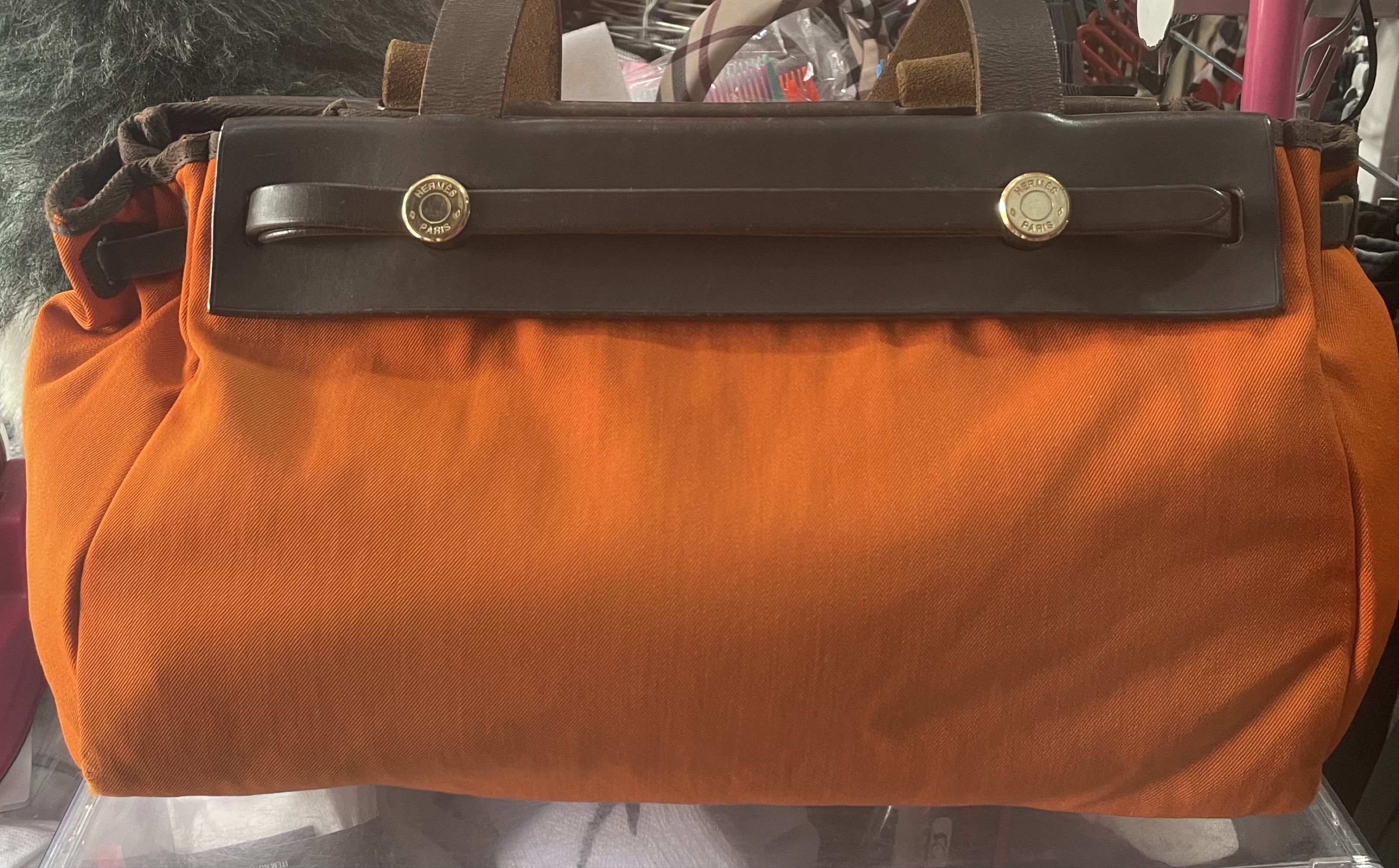 Authentic HERMES Herbag (Category: Luxury Bags & Wallets) located in Quezon City. Submitted by brandedstuffsphils (Listing ID 1421325013, Image 1). Description: Authentic HERMES Herbag Cabas orange & red (shoulder) w/ alternate (red color, selfom used) . No inclusions.