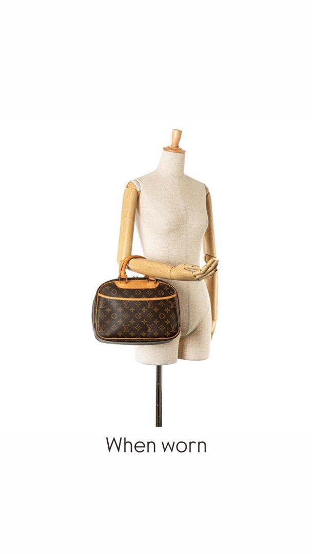 Authentic Louis Vuitton Trouville Handbag (Category: Luxury Bags & Wallets) located in San Pablo. Submitted by with.jacque (Listing ID 1421450998, Image 2). Description: - Authentic Louis Vuitton Trouville handbag - Iconic monogram canvas - Structured shape with dual top handles - Secure zip closure - Interior with multiple compartments - Exterior shows wear on corners and handles - Elegant gold-toned hardware.
