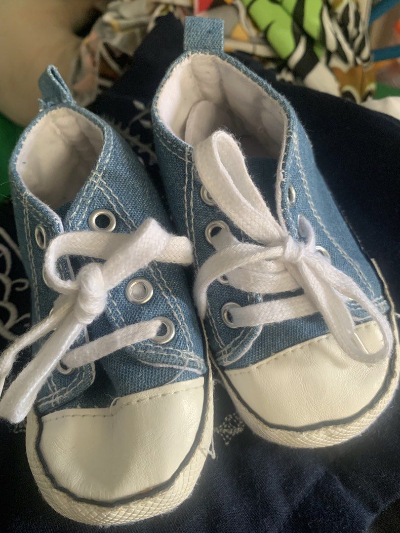 Baby Denim Sneakers Size 3 (Category: Babies & Kids Fashion) located in Cainta. Submitted by declutteringmoms (Listing ID 1421390588, Image 2). Description: - Adorable denim blue baby sneakers - White laces and toe cap - Size 3 - Approximately 13cm long - Polka dot soles with "Baby Baby" and star design - Perfect for babies!.