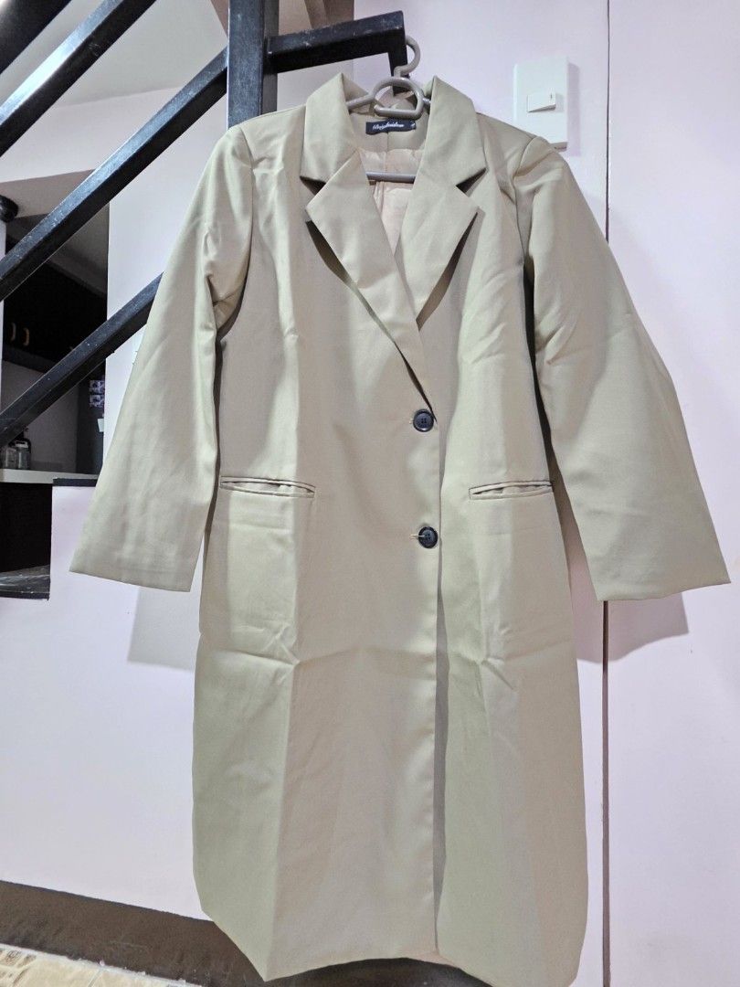 Baiyibaishun Long Coat - Size L (Category: Coats, Jackets and Outerwear) located in Marikina City. Submitted by wilmiles (Listing ID 1421393411, Image 1). Description: - Brand: Baiyibaishun - Style: Long coat - Design: Classic with notched lapel - Features: Two front pockets, single-button closure - Fit: Tailored - Color: Neutral - Size: L.