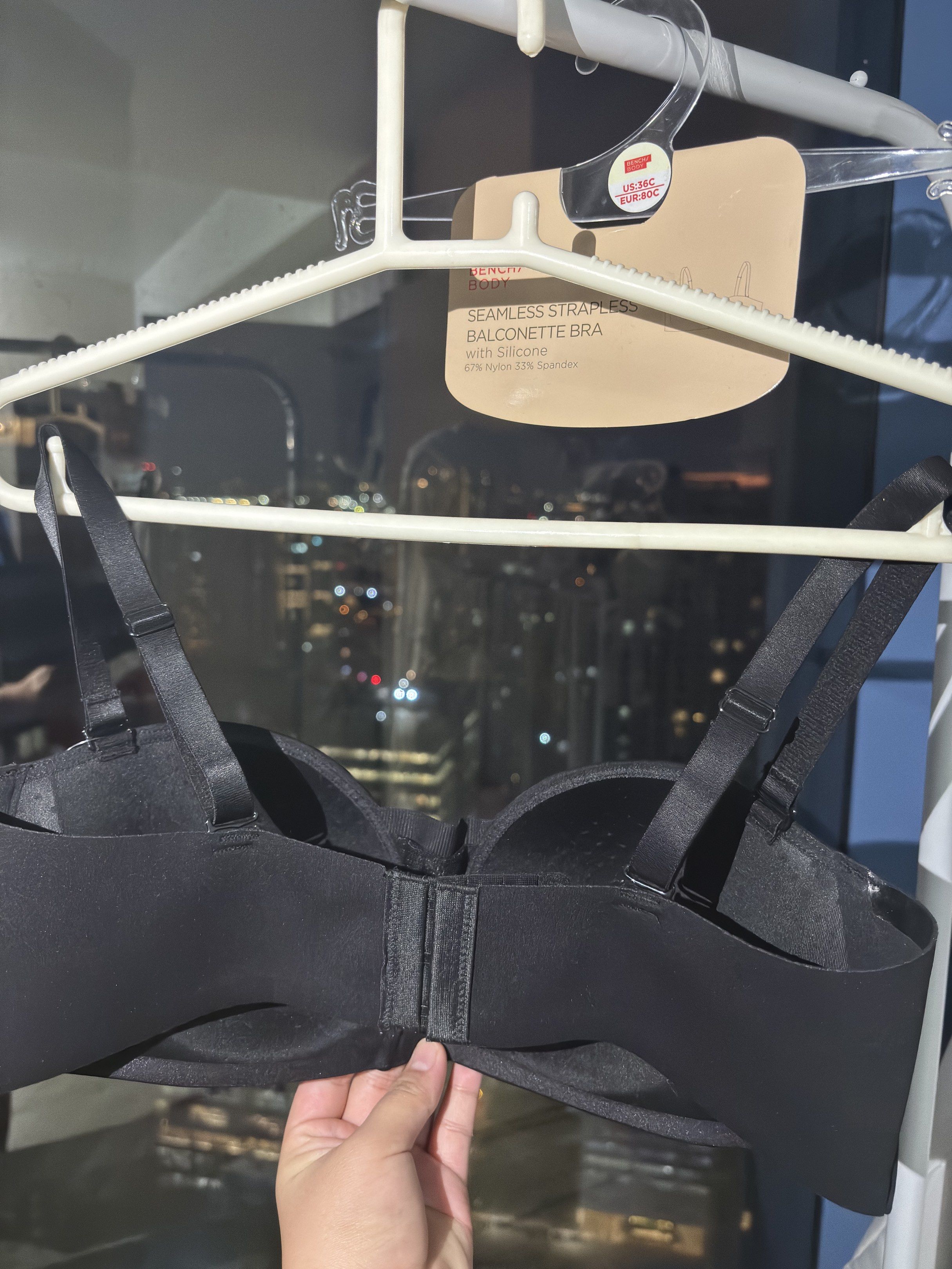 Bench Body Seamless Strapless Balconette Bra (Category: Undergarments & Loungewear) located in Makati City. Submitted by regina_2727 (Listing ID 1421382951, Image 2). Description: Black Bench Body seamless strapless balconette bra. -Features a silicone design for a secure fit. -The bra has adjustable straps and a hook-and-eye closure at the back. -The tag indicates the size is 36C and the original price is 599.75 PHP..