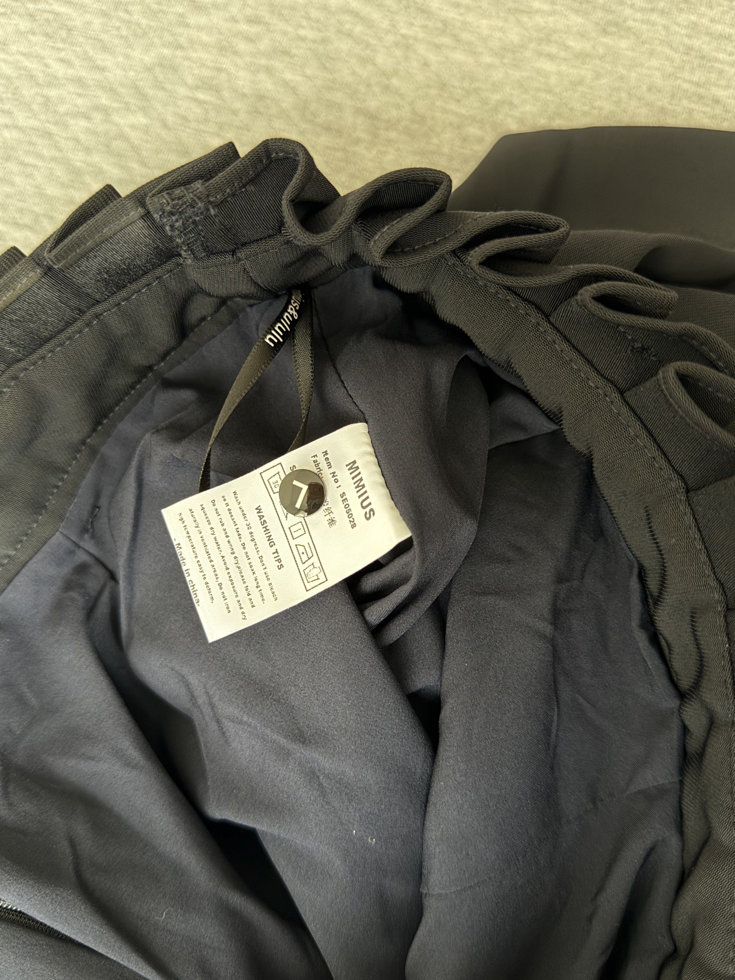 BKK HQ Black Skorts (Category: Shorts) located in Manila. Submitted by qfayeeeee (Listing ID 1421340054, Image 3). Description: Size: It says large but runs small Waist - 28" laid flat Length - 14" Heavy Material - MIMIUS black pleated shorts - Size: L - High-waisted design - Ruffled waistband - Back zipper closure - Built-in lining - Includes washing instructions.