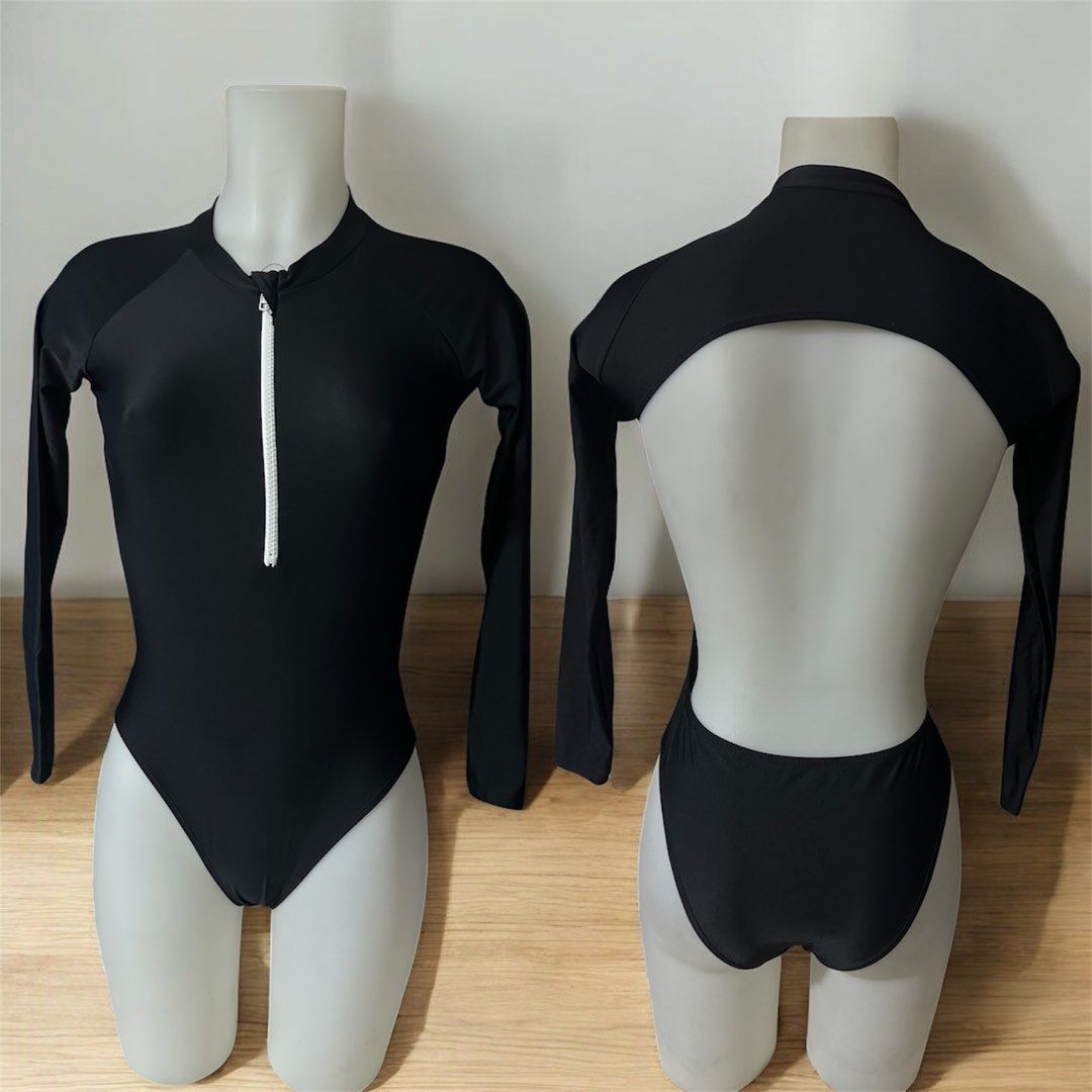 Black Long Sleeve Swimsuit (Category: Bikinis & Swimsuits) located in Manila. Submitted by AngelResty (Listing ID 1421437115, Image 1). Description: - Black one-piece swimsuit - Long sleeves - Front zipper - High-cut leg design - Unique open back - Smooth, stretchy material - Ideal for swimming and water activities.