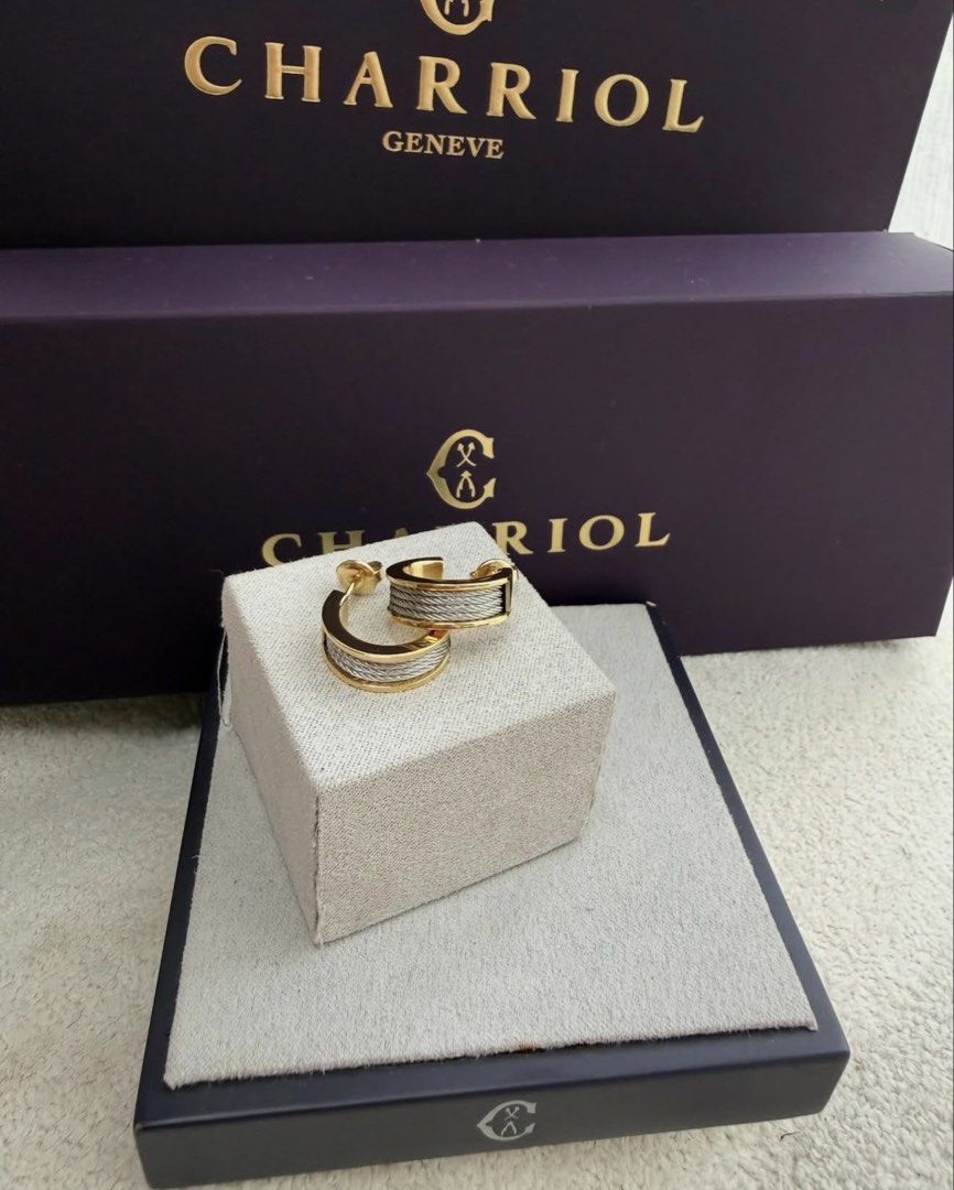 Charriol Geneva Earrings (Category: Earrings) located in San Pablo. Submitted by with.jacque (Listing ID 1421450901, Image 1). Description: - Charriol Geneva earrings - Gold-tone hoop design - Features cable detail - Comes with original box - Stylish accessory.