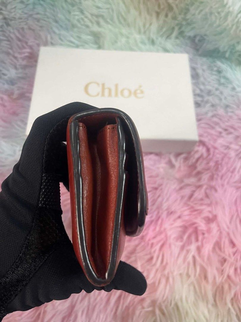 Chloe Leather Wallet (Category: Luxury Bags & Wallets) located in Manila. Submitted by euphoriathriftco (Listing ID 1421428396, Image 3). Description: - Authentic Chloe wallet - Rich burgundy color - Gold-tone 'C' logo - Multiple card slots - Zippered compartment - Comes with original box.