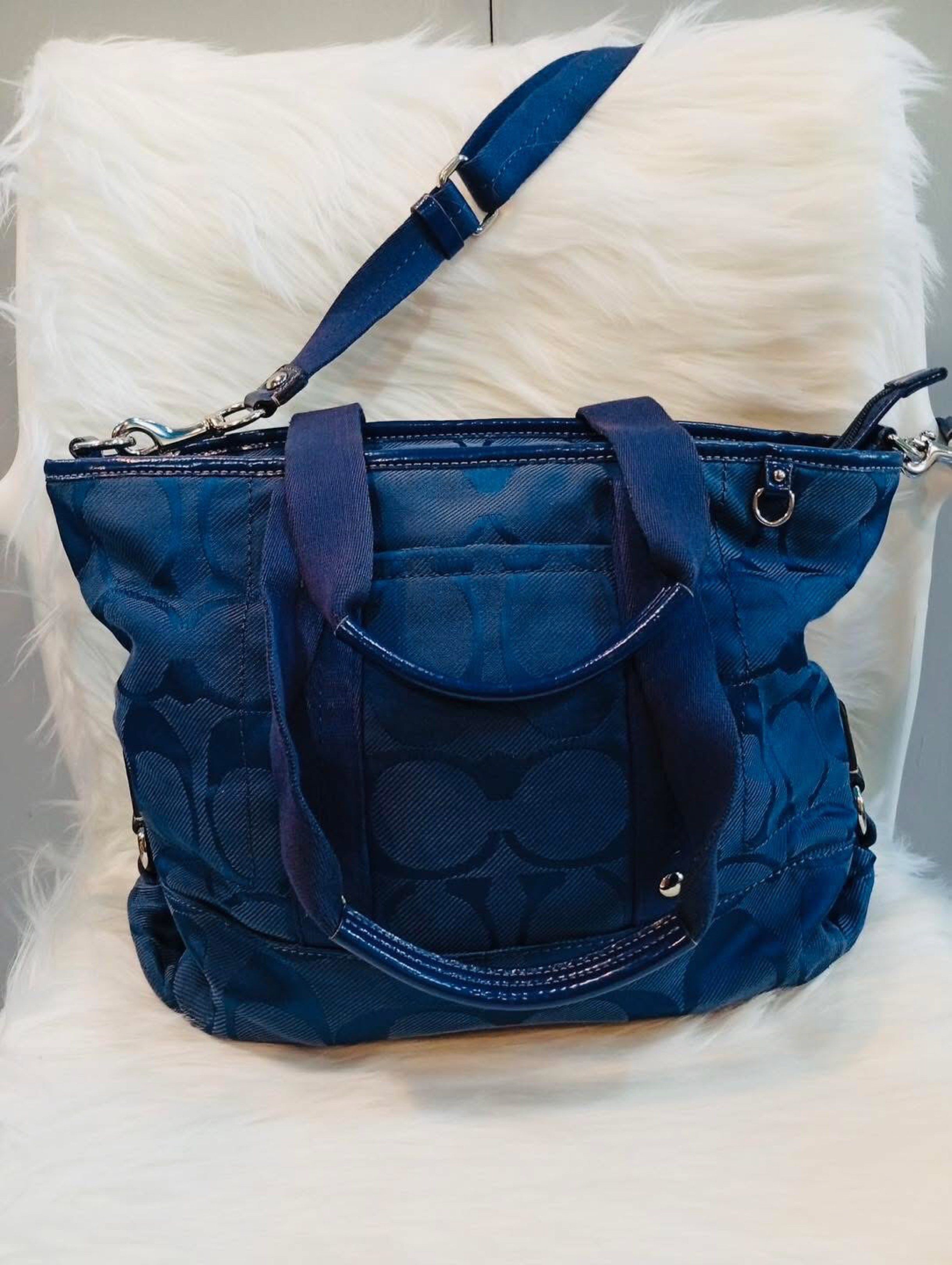 COACH Two-Way Bag (Authentic) (Category: Luxury Bags & Wallets) located in Quezon City. Submitted by juanna. (Listing ID 1421306618, Image 1). Description: ✅ Authentic COACH two-way bag ✅Navy blue color ✅Can be worn as crossbody or carried by handles ✅Classic COACH design ✅Washable canvass material ✅With minor flaw (last photo).