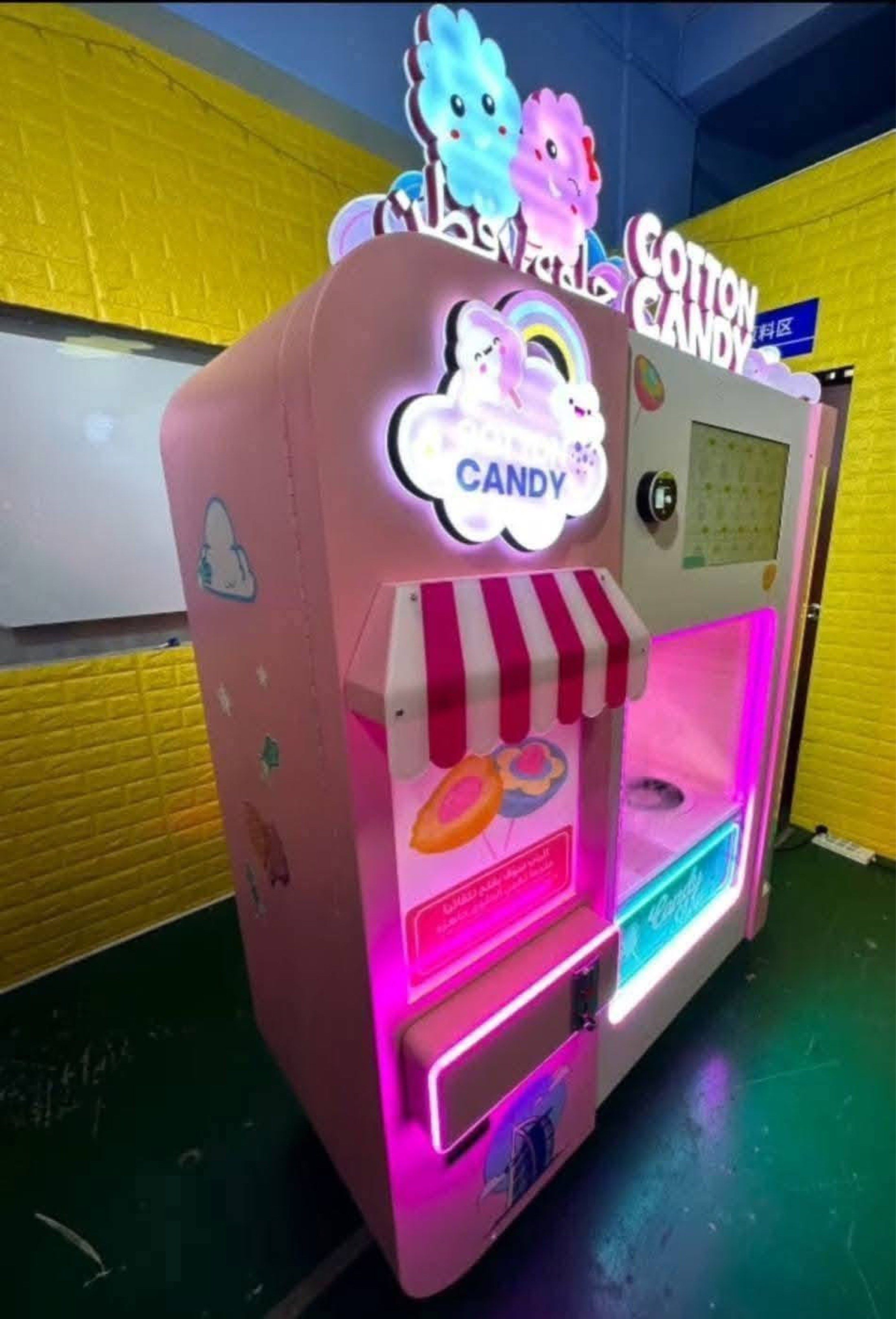 Cotton Candy Vending Machine (Category: Coffee Machines & Makers) located in San Pablo. Submitted by vennisa.sportssupplies (Listing ID 1421362201, Image 2). Description: Cotton candy vending machine is perfect for parties or events. It features a colorful design with LED lights and a user-friendly interface. The machine dispenses cotton candy and has a built-in screen. It has a candy shop design and is likely to attract customers. It is a great 
